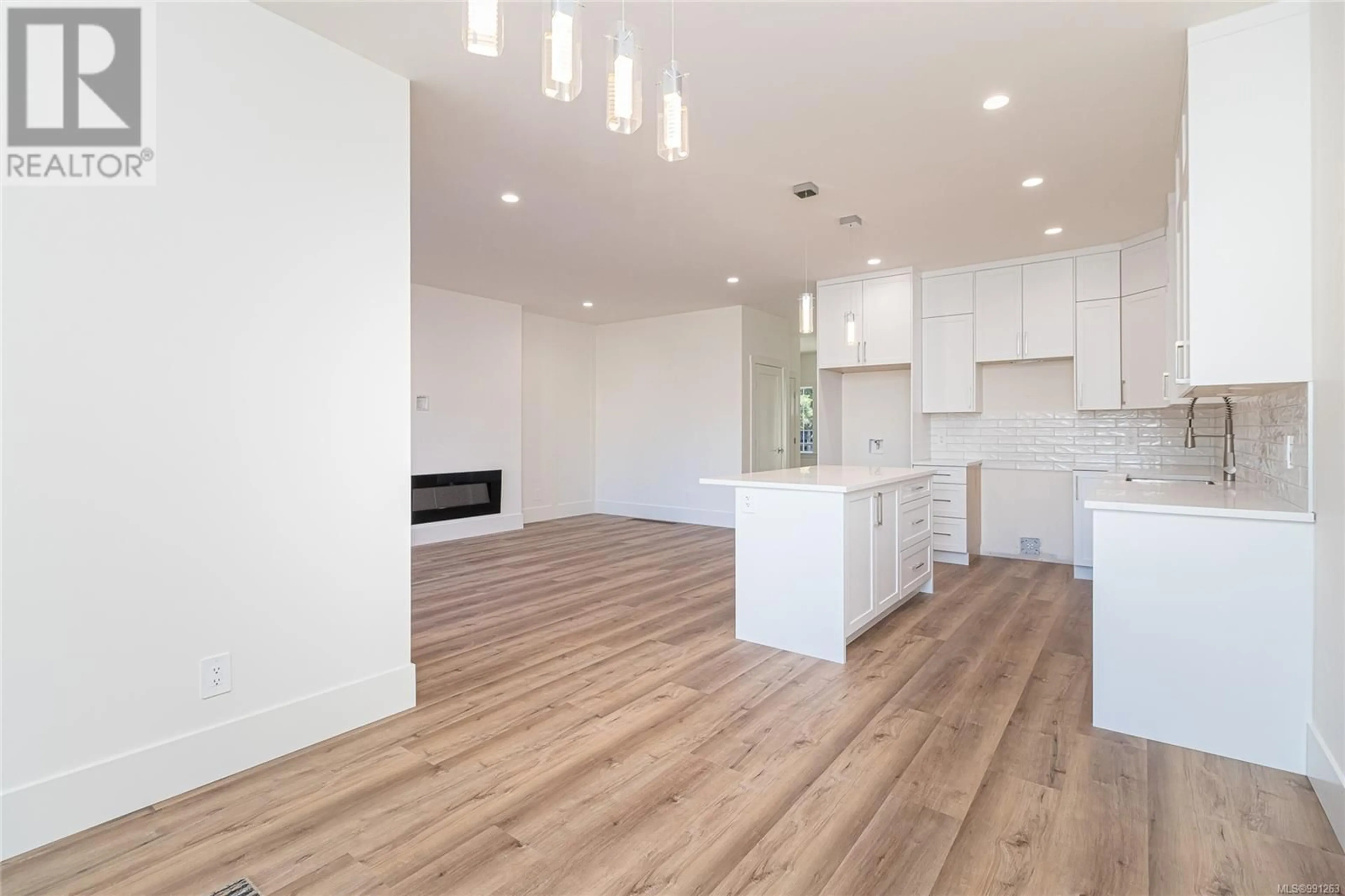 Open concept kitchen, wood/laminate floor for 1939 MAPLE AVENUE SOUTH, Sooke British Columbia V9Z0N9