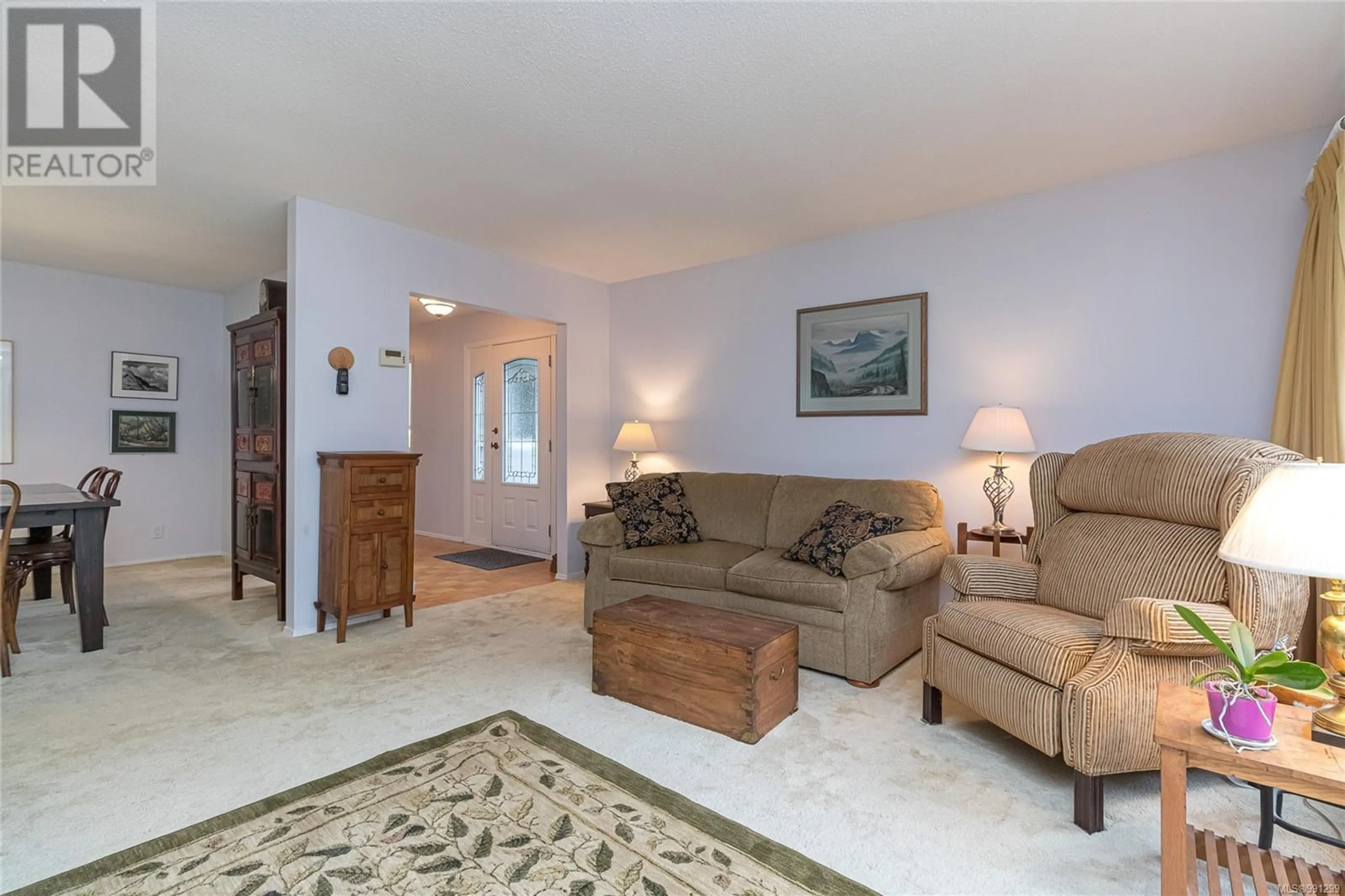 Living room with furniture, carpet floor for 4043 Hopesmore Pl, Saanich British Columbia V8N5T1