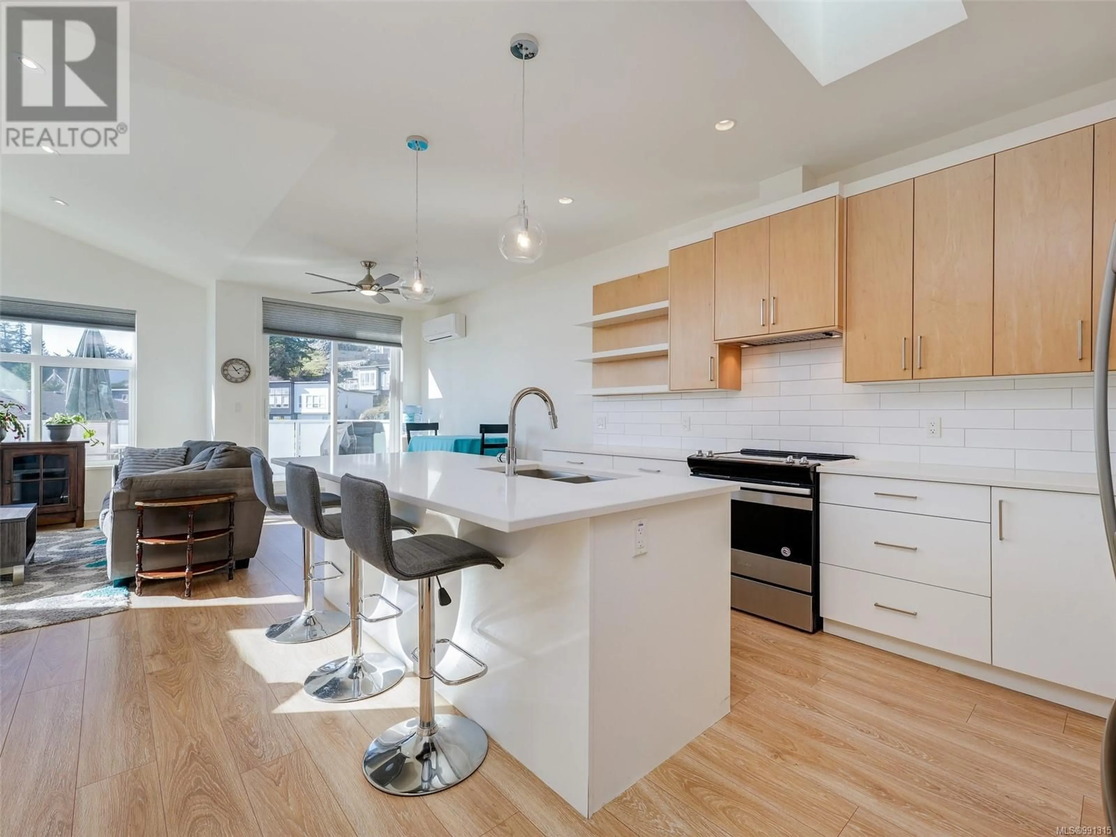 Open concept kitchen, wood/laminate floor for 2197 Winfield Dr, Sooke British Columbia V9Z1P1