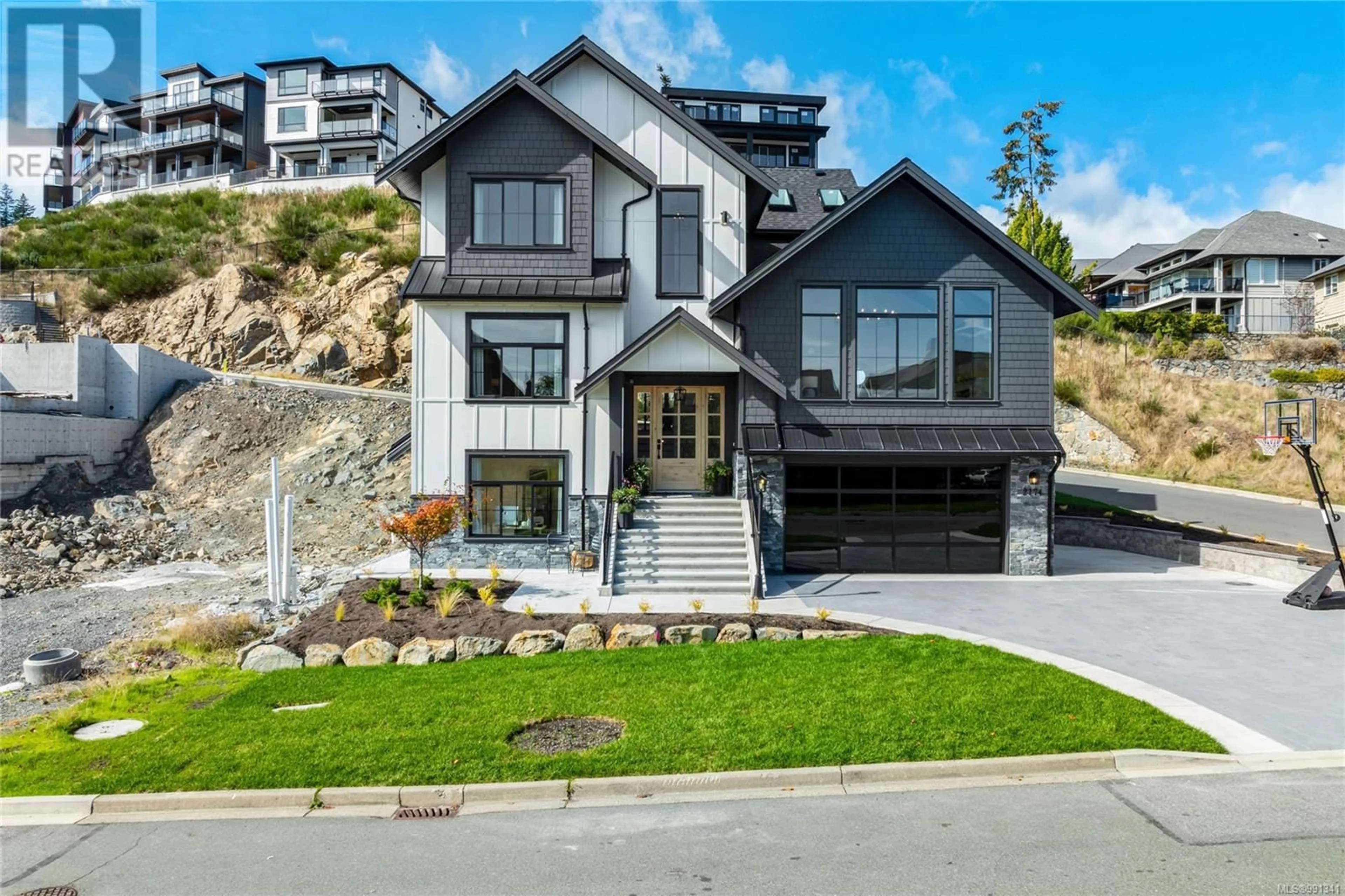 Home with brick exterior material, mountain view for 2174 Spirit Ridge Dr, Langford British Columbia V9B0B5