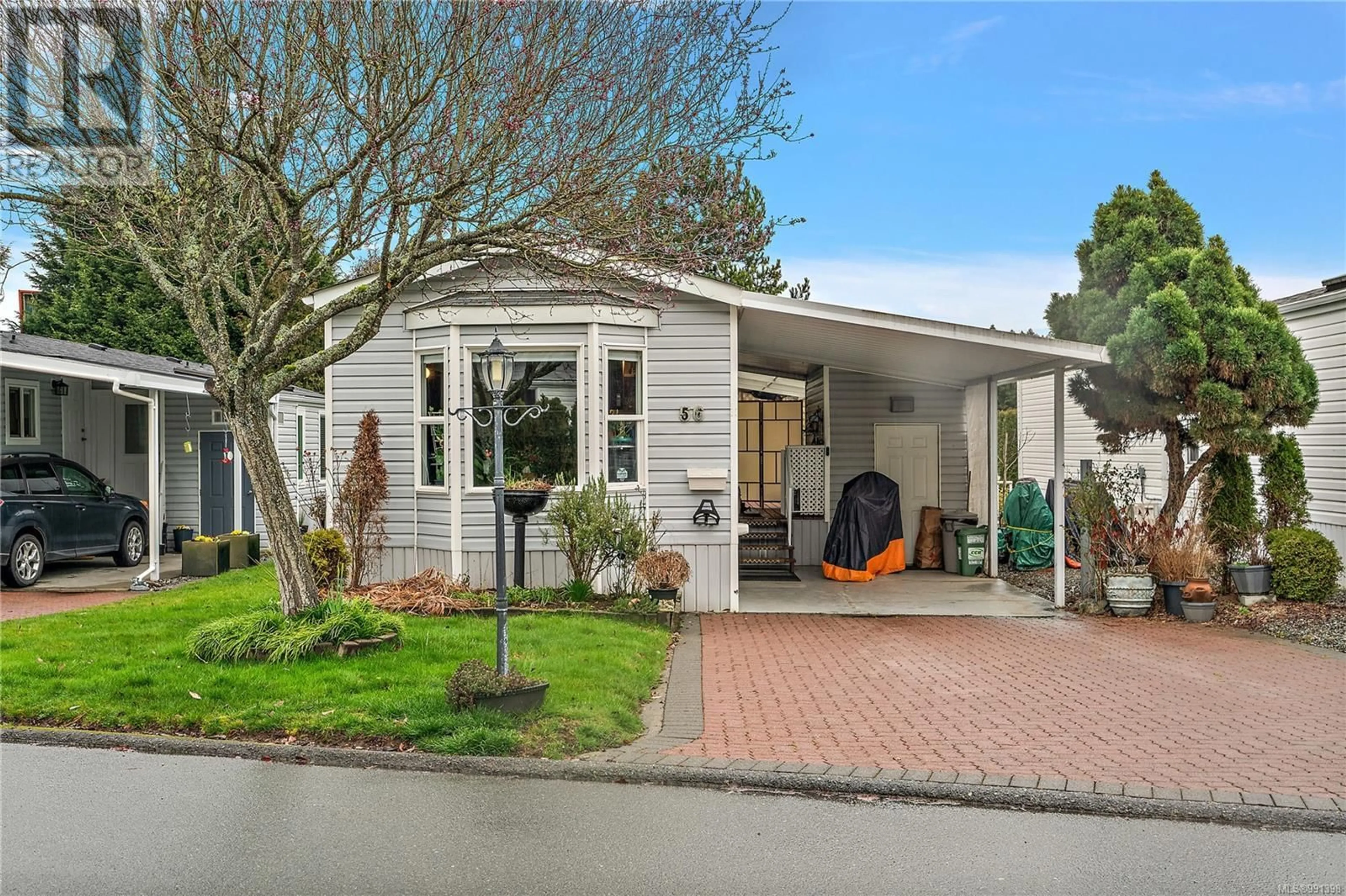Home with vinyl exterior material, street for 56 - 7583 CENTRAL SAANICH ROAD, Central Saanich British Columbia V8M2B6