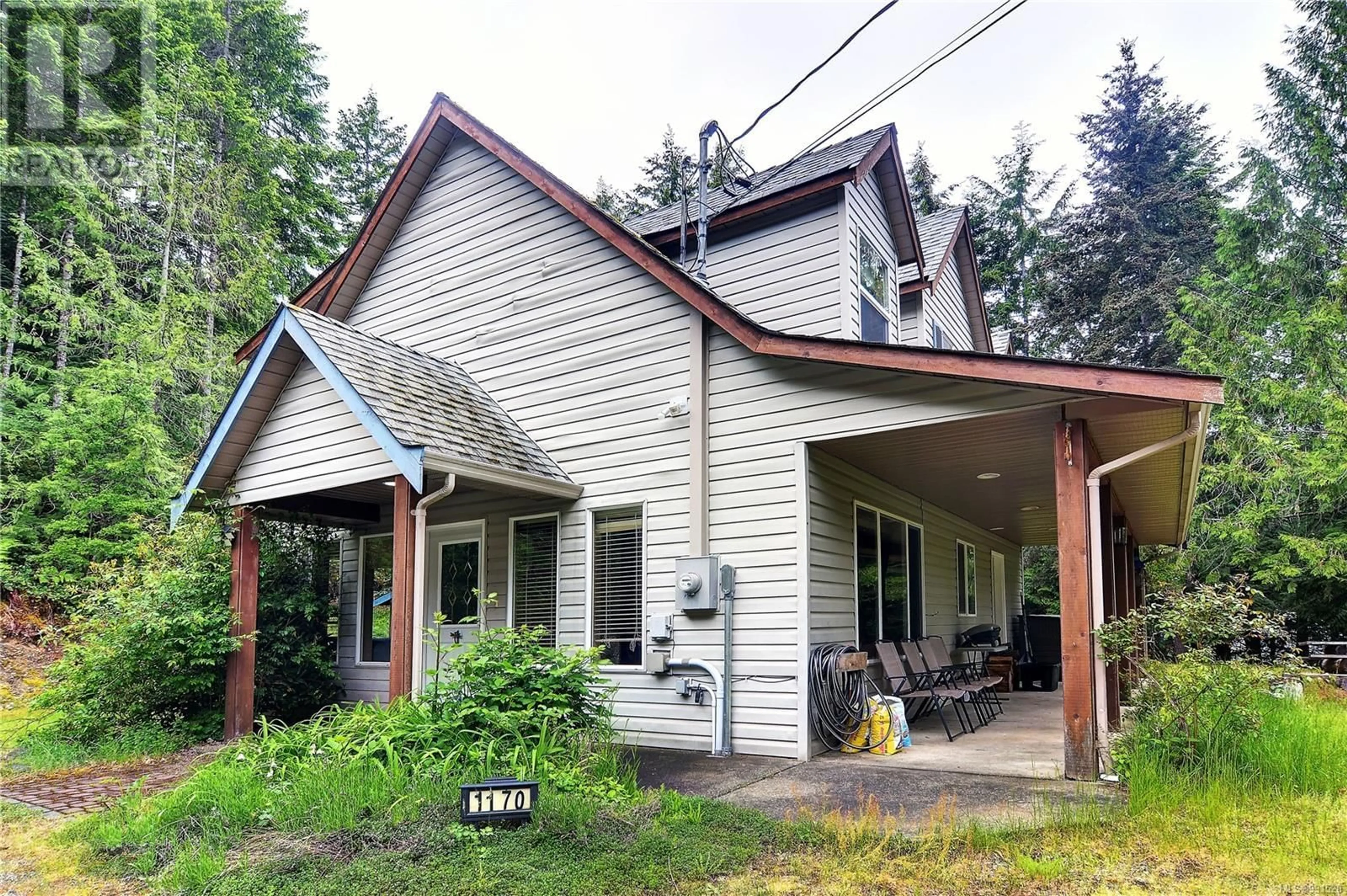 Home with vinyl exterior material, street for 1170 CORCAN ROAD, Qualicum Beach British Columbia V9K2R6