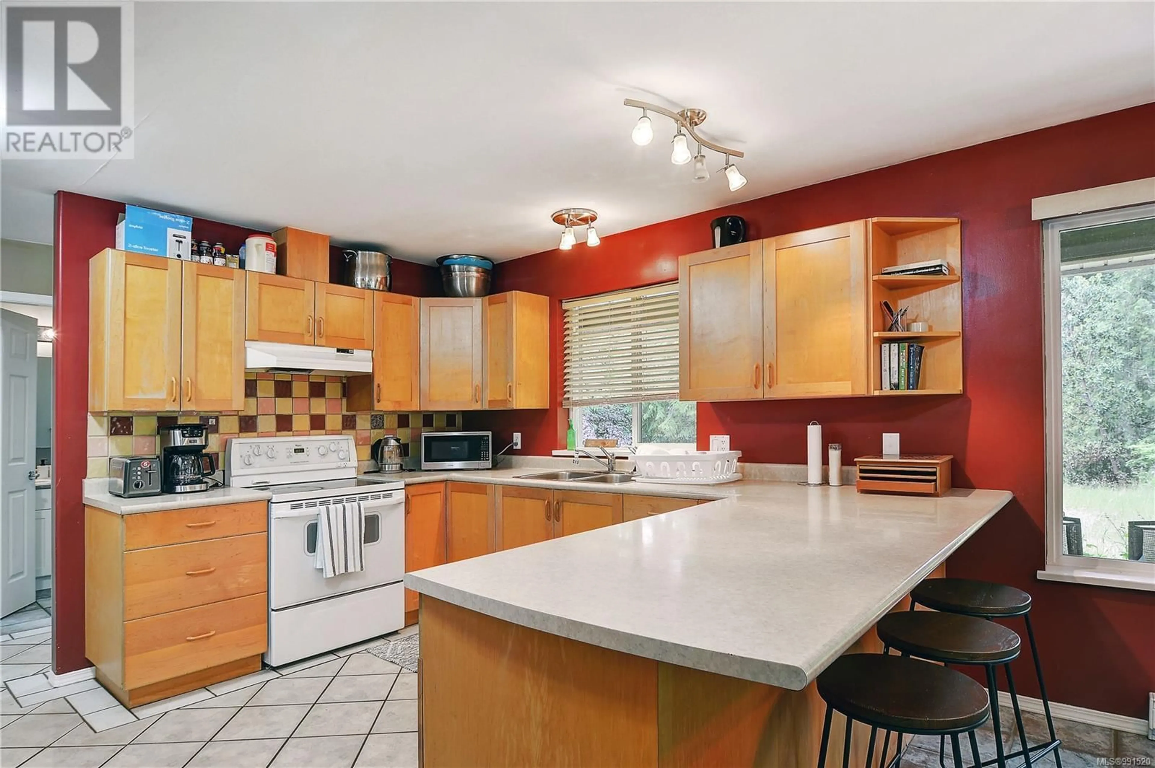 Open concept kitchen, ceramic/tile floor for 1170 CORCAN ROAD, Qualicum Beach British Columbia V9K2R6