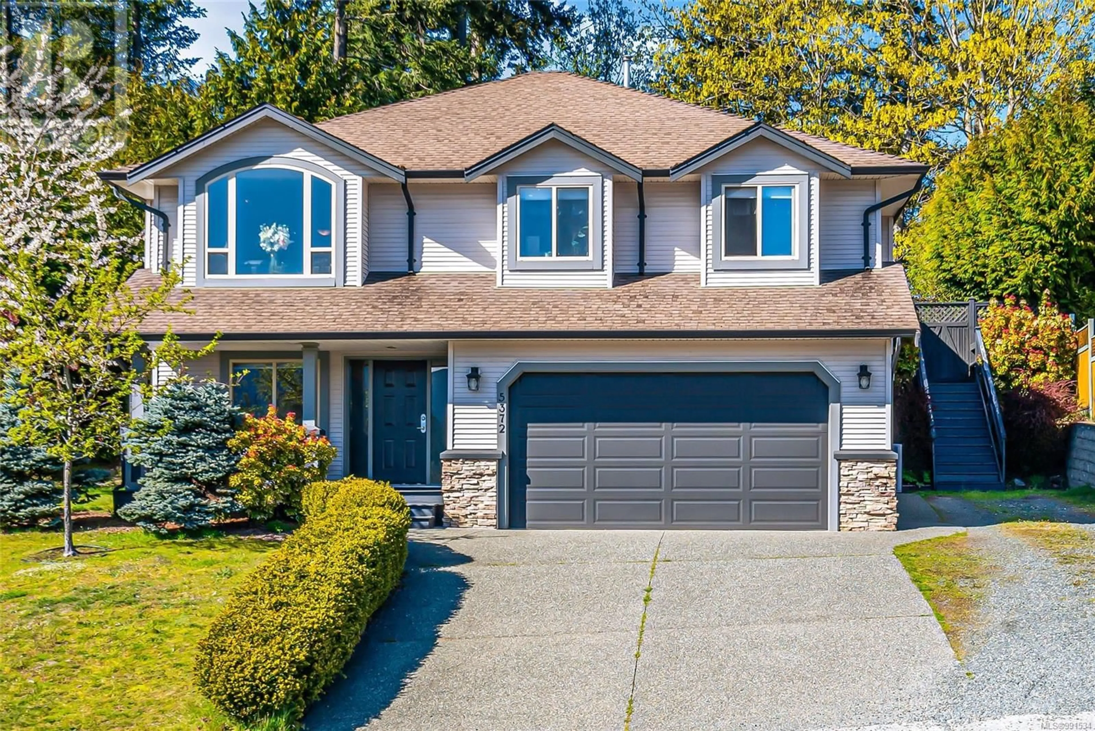 Home with vinyl exterior material, street for 5372 Colbourne Dr, Nanaimo British Columbia V9T6N5