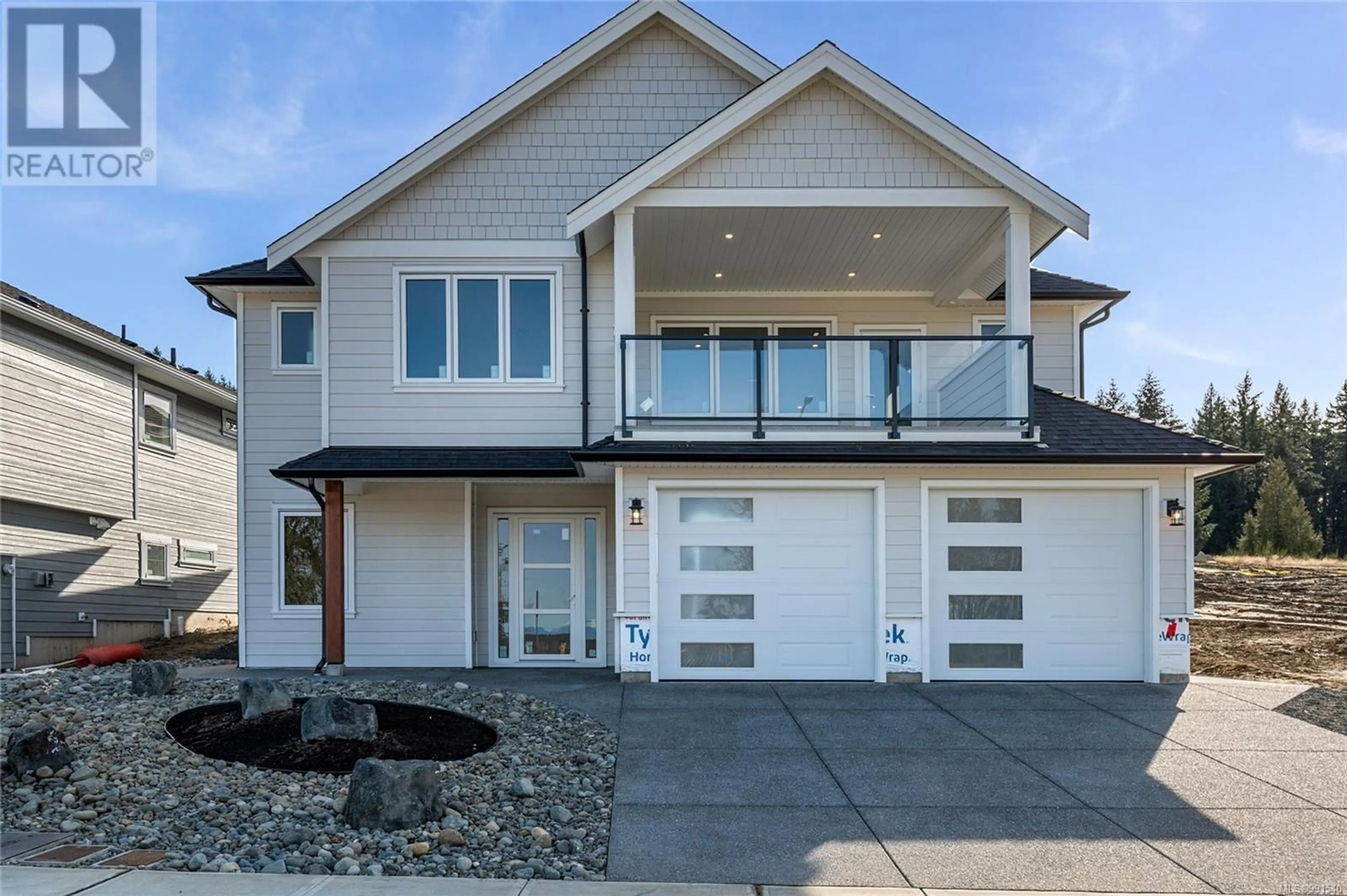 Home with vinyl exterior material, street for 1783 Crown Isle Blvd, Courtenay British Columbia V9N0K1