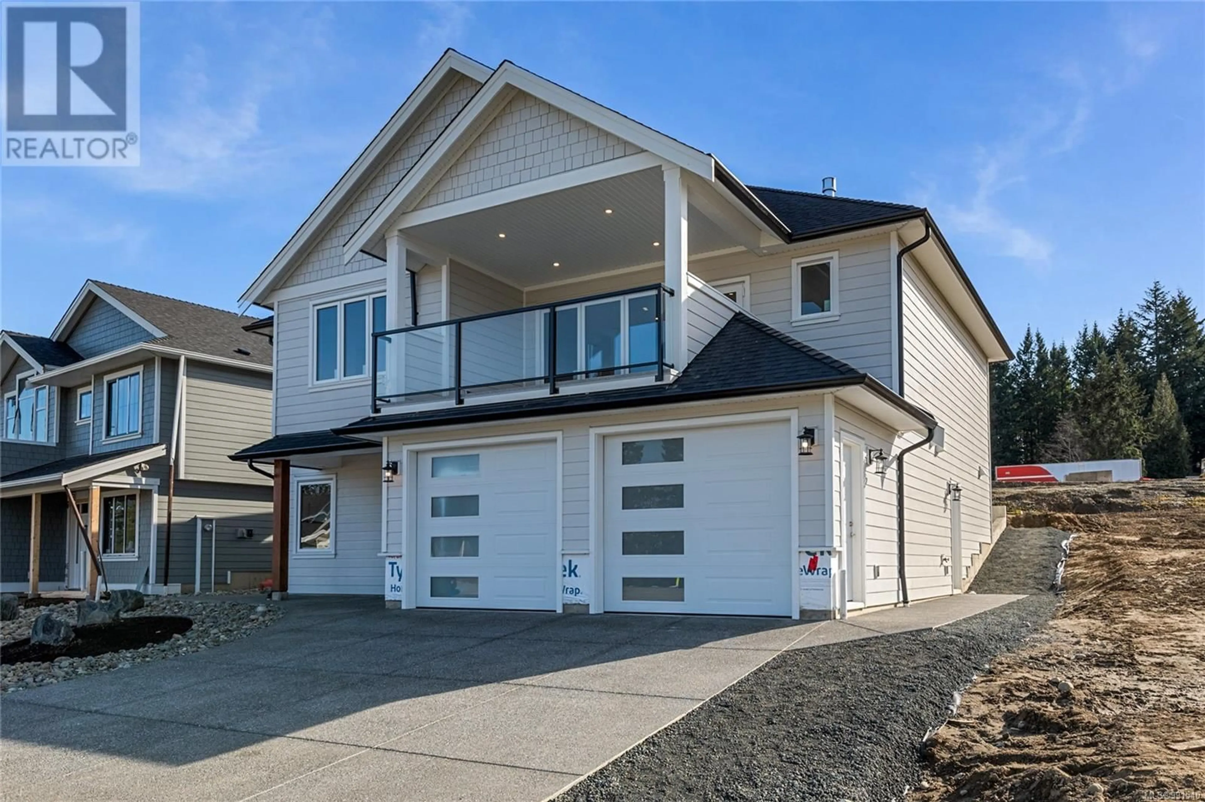 Home with vinyl exterior material, street for 1783 Crown Isle Blvd, Courtenay British Columbia V9N0K1