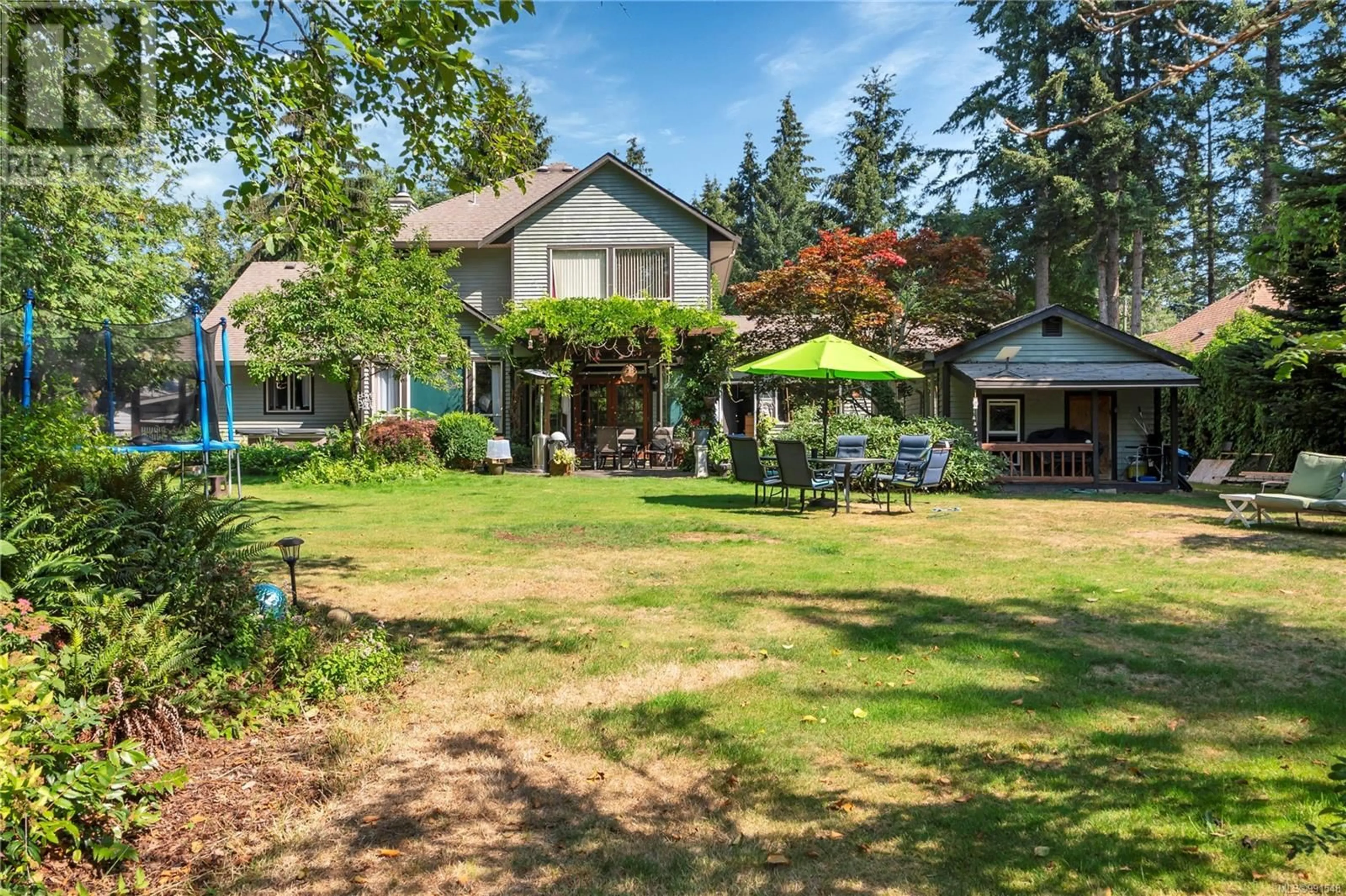 A pic from outside/outdoor area/front of a property/back of a property/a pic from drone, unknown for 8856 MCLAREY AVENUE, Black Creek British Columbia V9J1A3