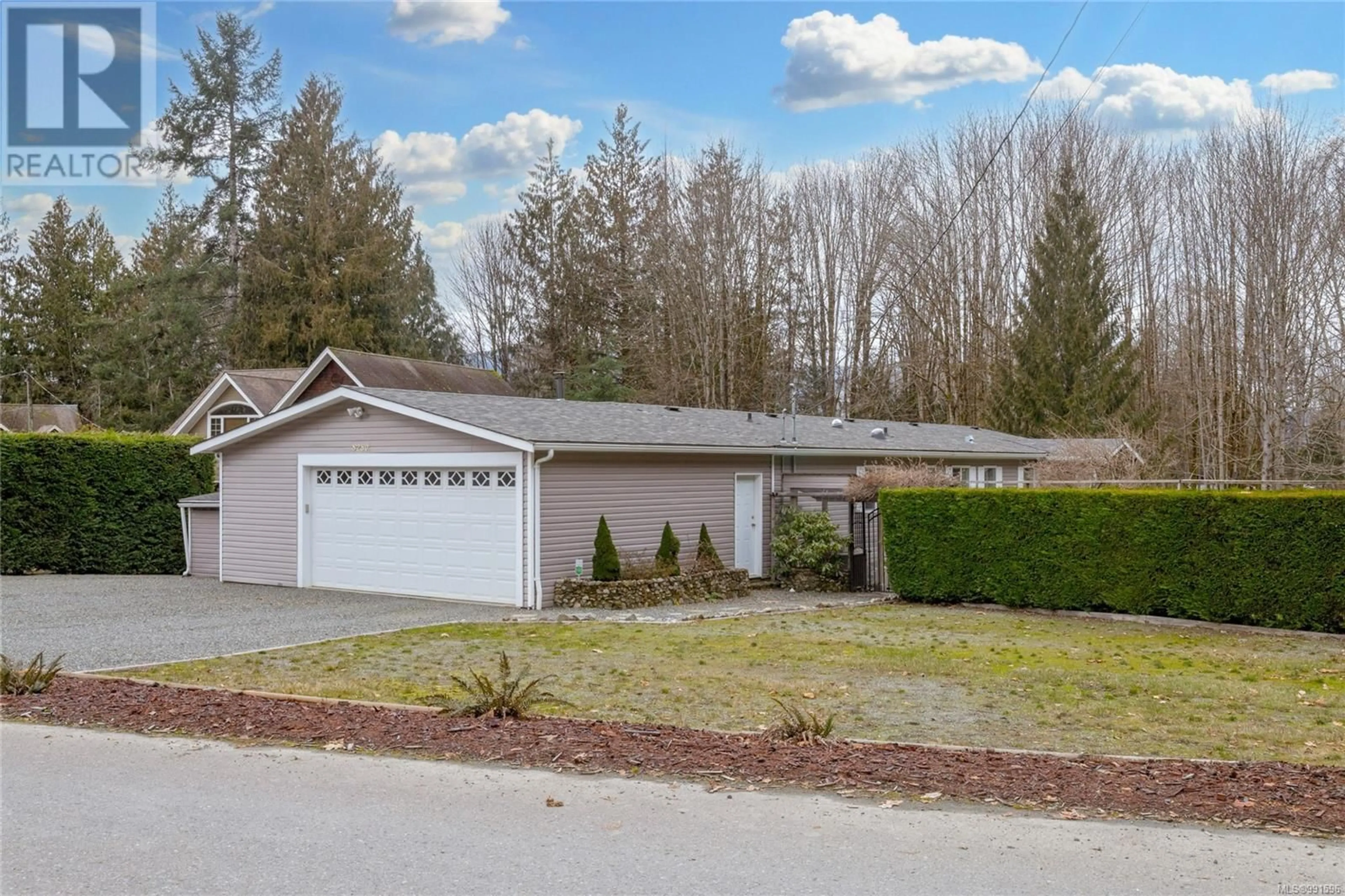 Home with vinyl exterior material, street for 8250 PRICE ROAD, Youbou British Columbia V0R3E1