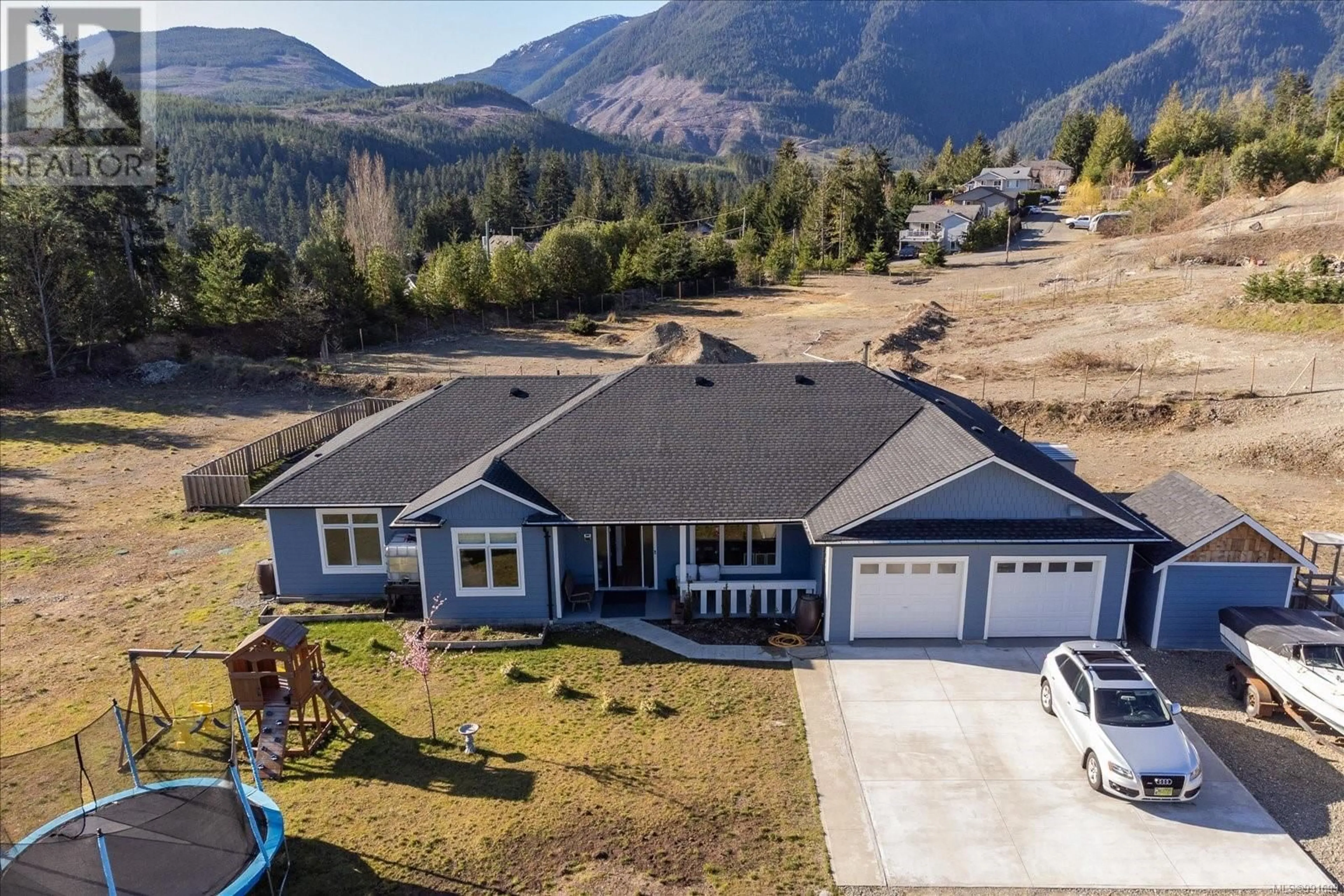 A pic from outside/outdoor area/front of a property/back of a property/a pic from drone, mountain view for 1665 Meadowood Way, Qualicum Beach British Columbia V9K2S3