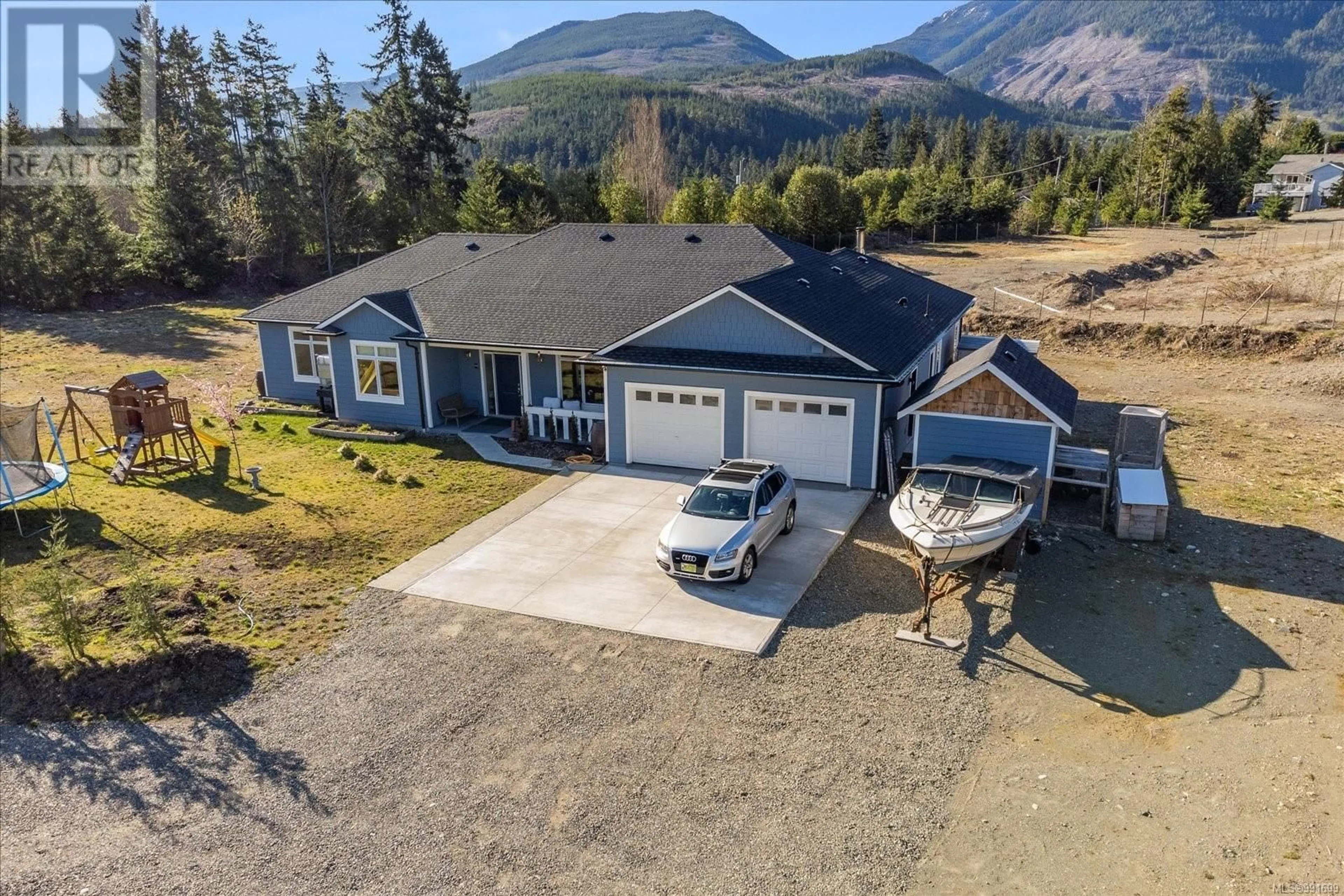 A pic from outside/outdoor area/front of a property/back of a property/a pic from drone, mountain view for 1665 Meadowood Way, Qualicum Beach British Columbia V9K2S3