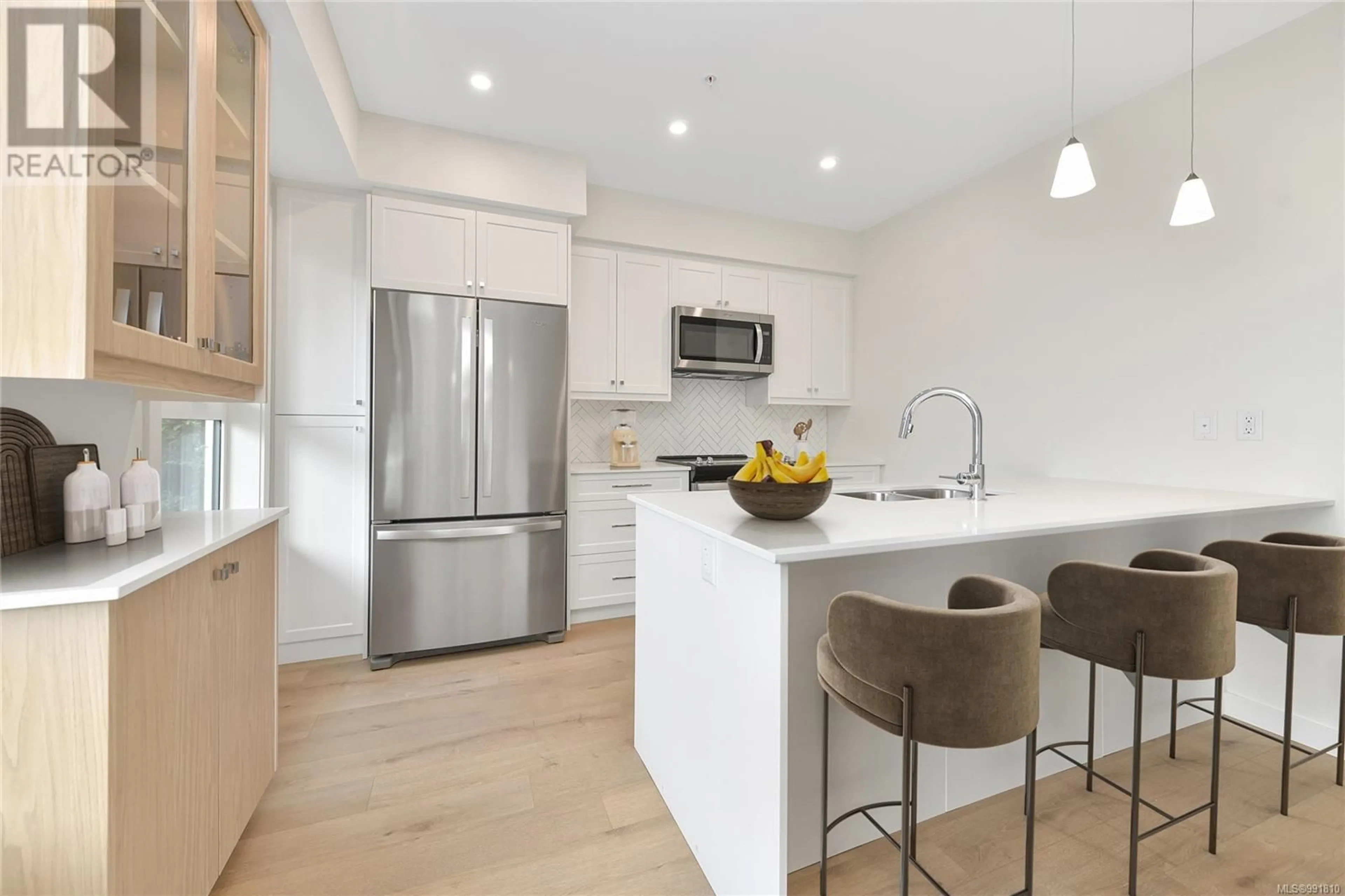 Open concept kitchen, wood/laminate floor for 203 - 9716 THIRD STREET, Sidney British Columbia V8L3A2