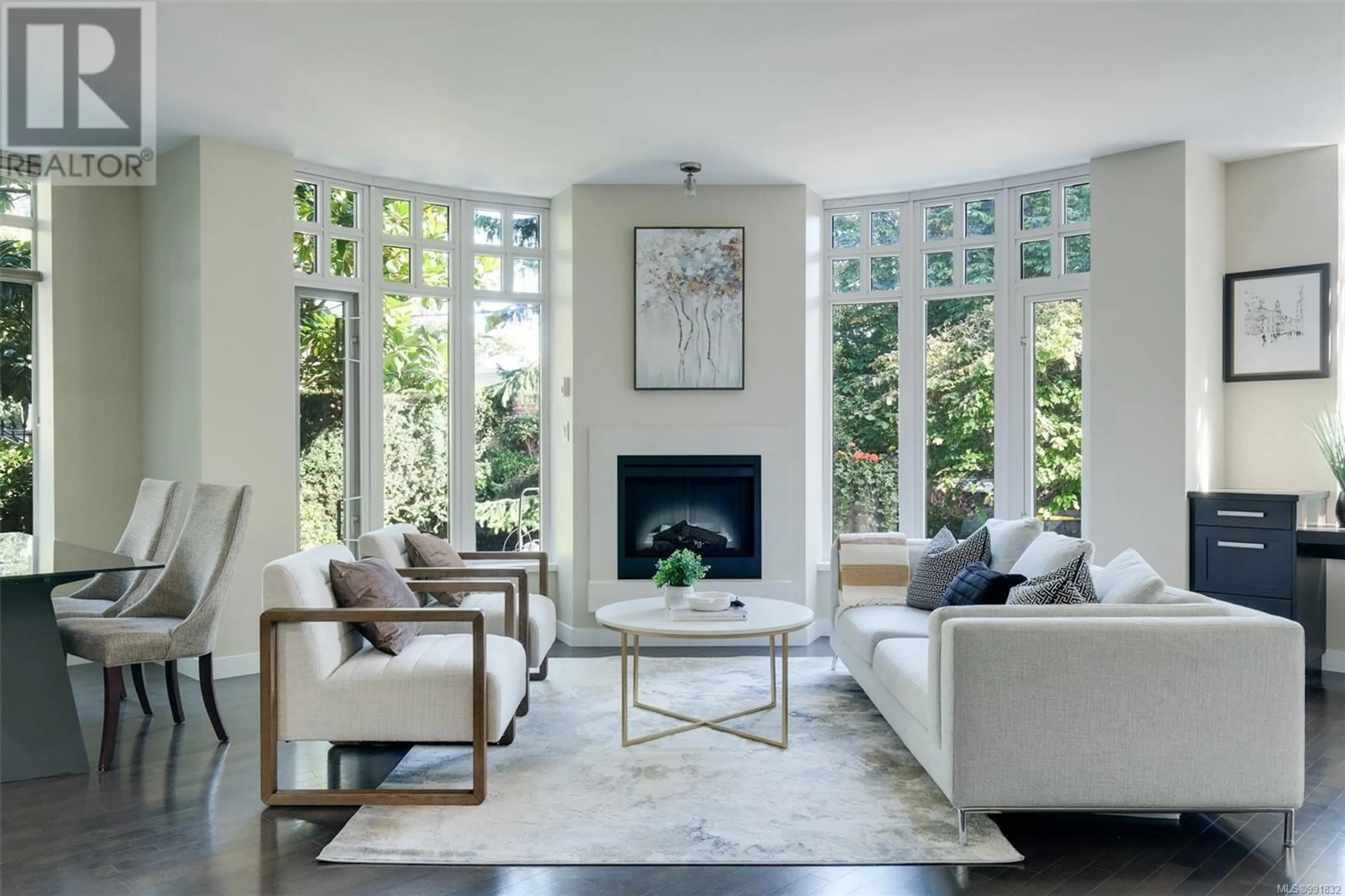 Living room with furniture, ceramic/tile floor for 206 - 999 BURDETT AVENUE, Victoria British Columbia V8V3G7