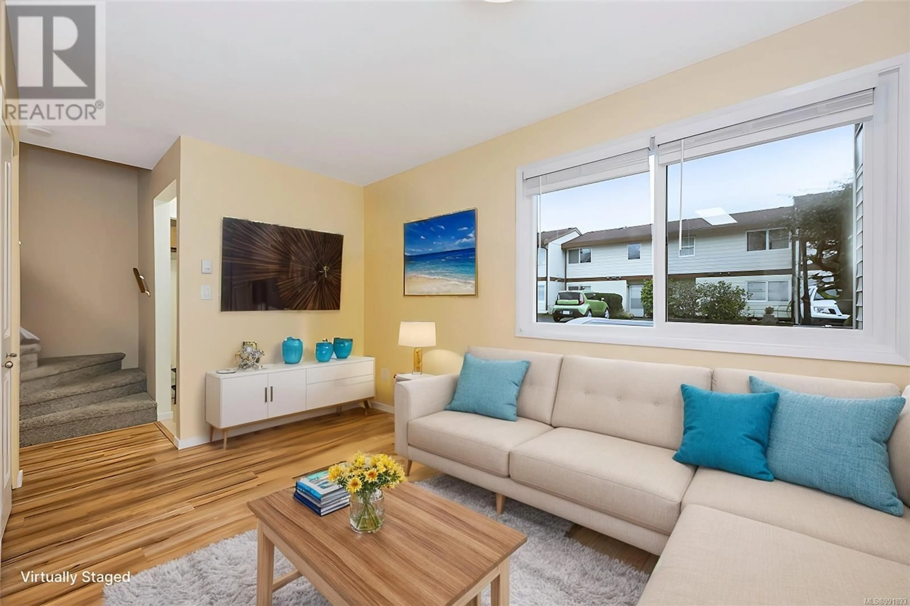 Living room with furniture, wood/laminate floor for 21 10046 Fifth St, Sidney British Columbia V8L2X9