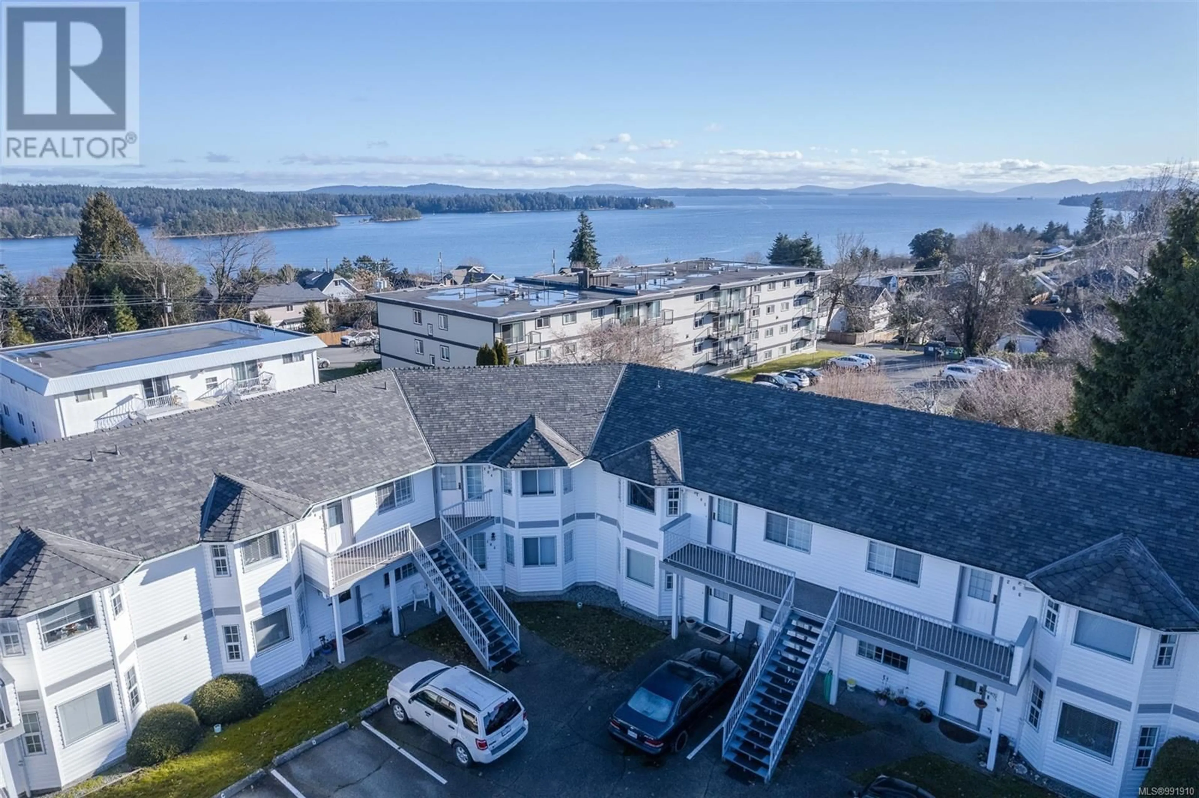 A pic from outside/outdoor area/front of a property/back of a property/a pic from drone, water/lake/river/ocean view for 103 219 Dogwood Dr, Ladysmith British Columbia V9G1S9