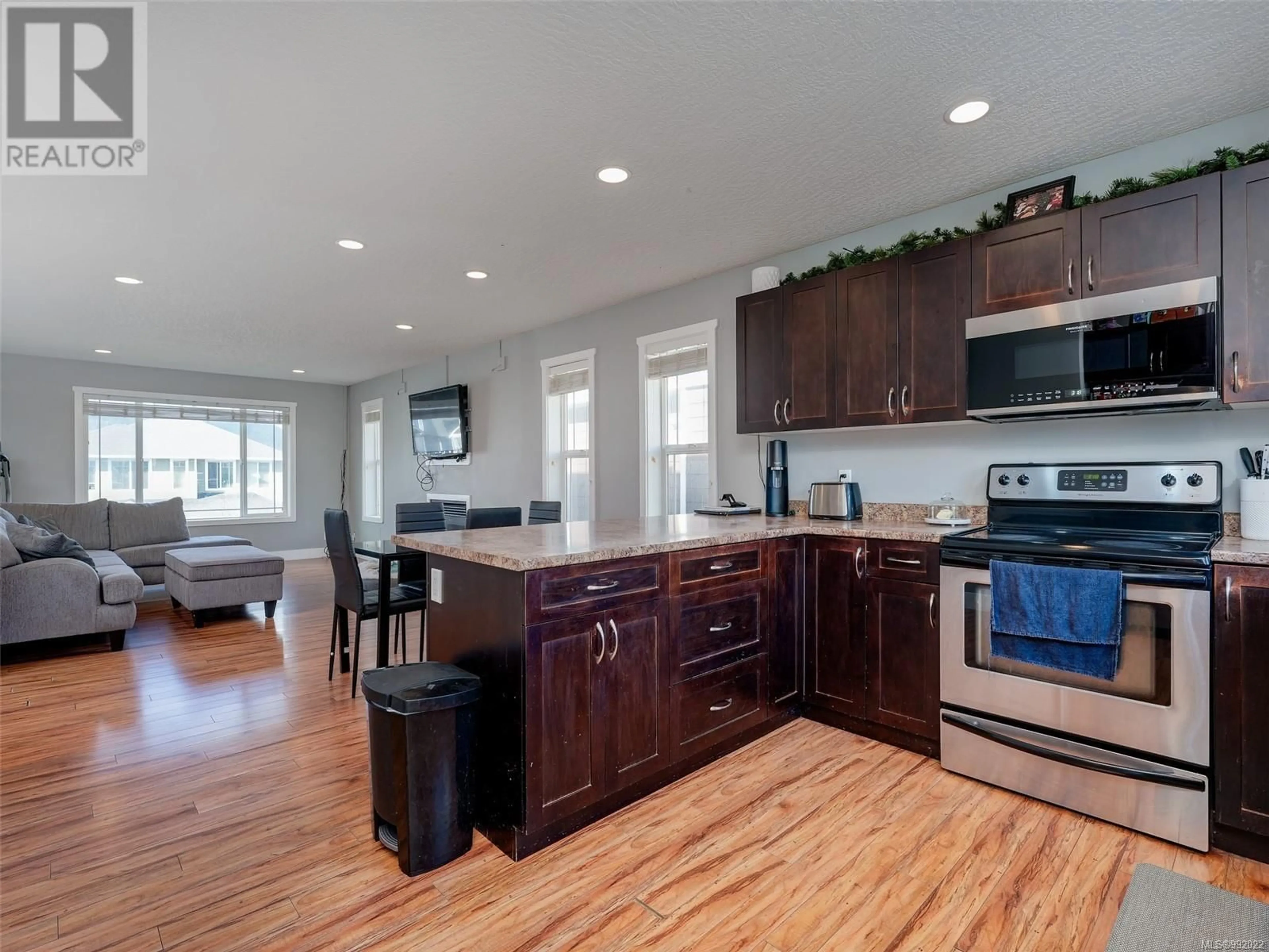 Open concept kitchen, wood/laminate floor for 6753 STEEPLE CHASE, Sooke British Columbia V9Z0W3