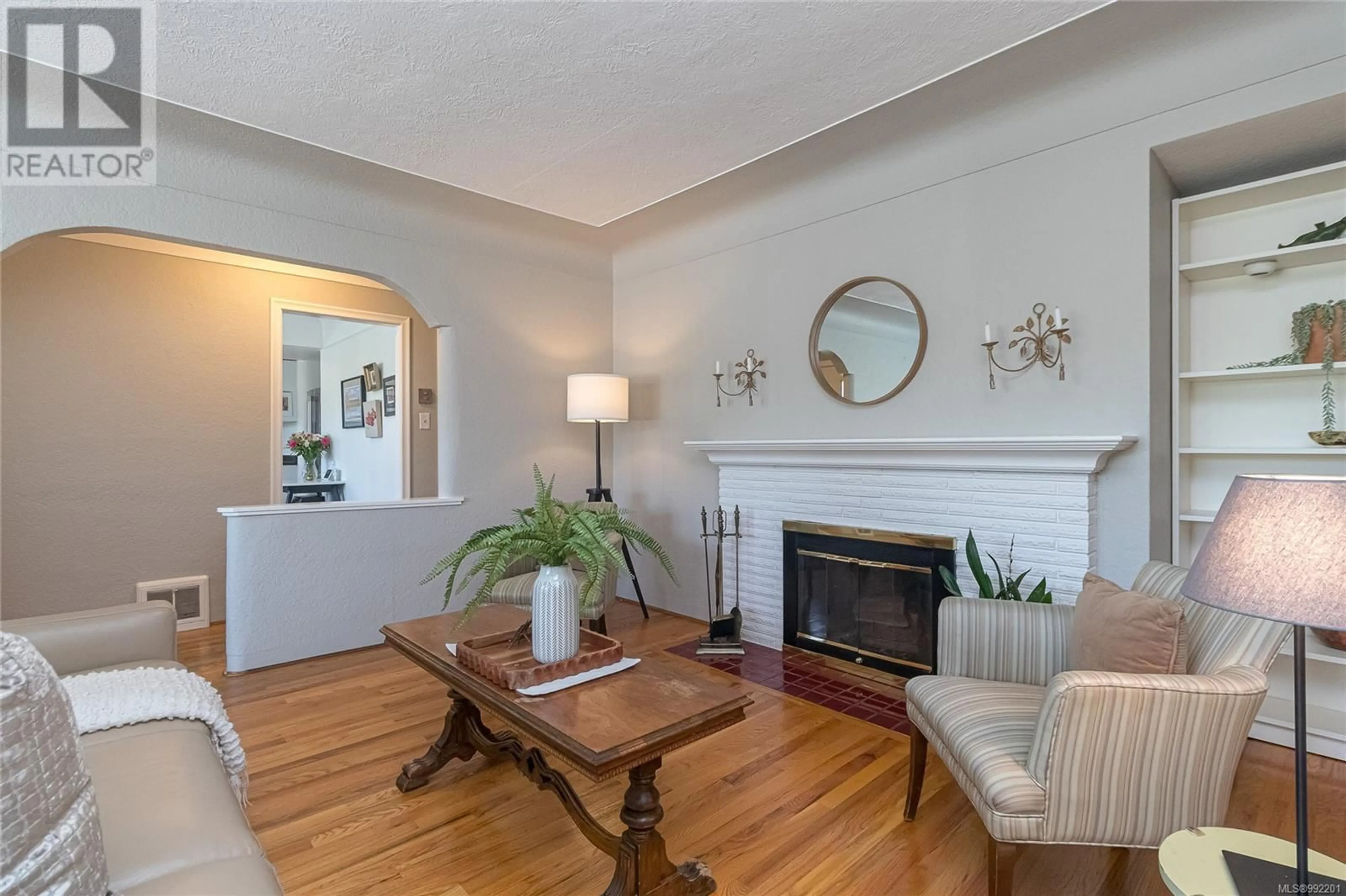 Living room with furniture, wood/laminate floor for 1475 STROUD ROAD, Victoria British Columbia V8T2K7