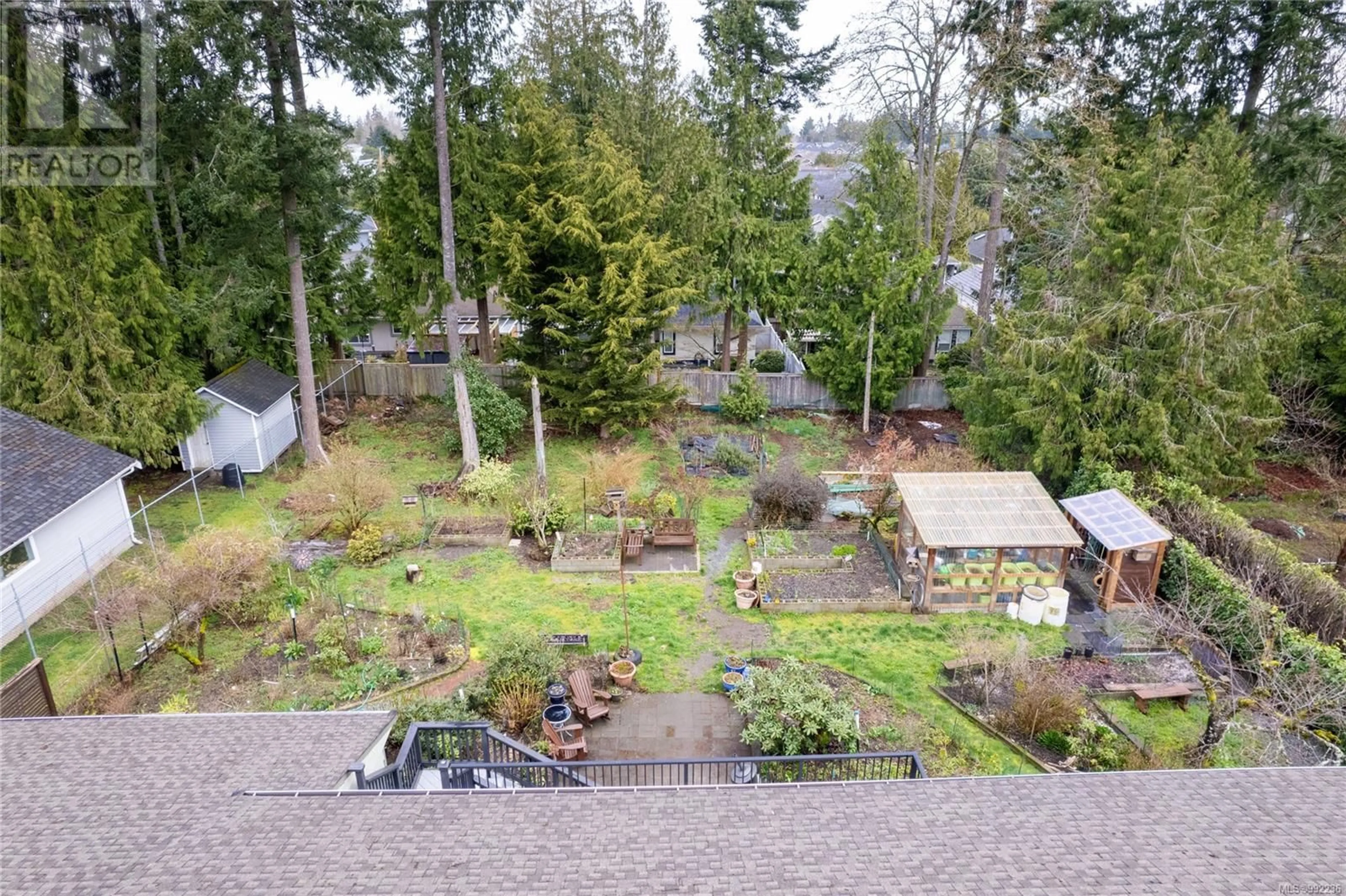 A pic from outside/outdoor area/front of a property/back of a property/a pic from drone, forest/trees view for 141 BUTLER AVENUE, Parksville British Columbia V9P1K9