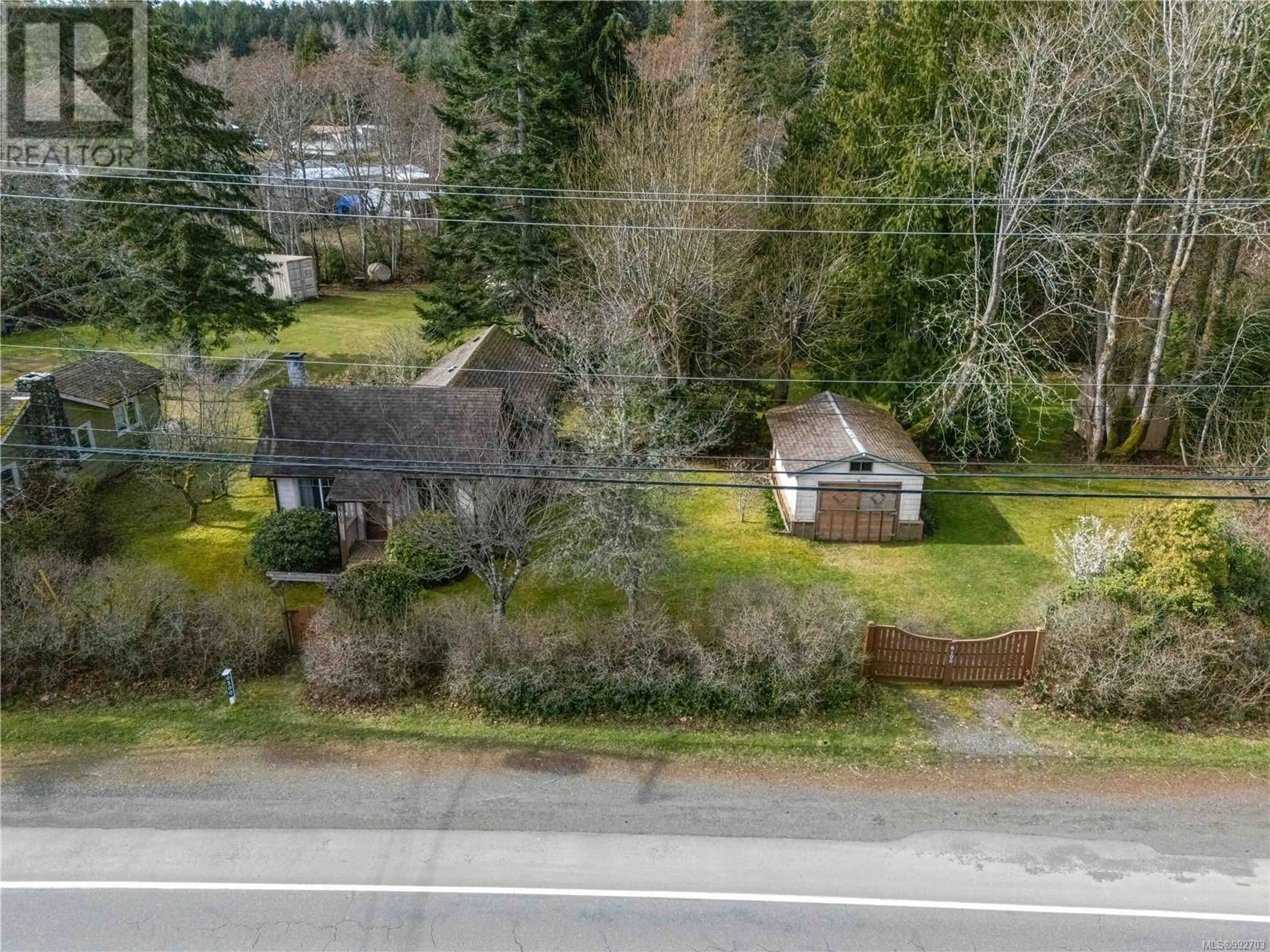 A pic from outside/outdoor area/front of a property/back of a property/a pic from drone, street for 6100 Island Hwy W, Qualicum Beach British Columbia V9K2E2