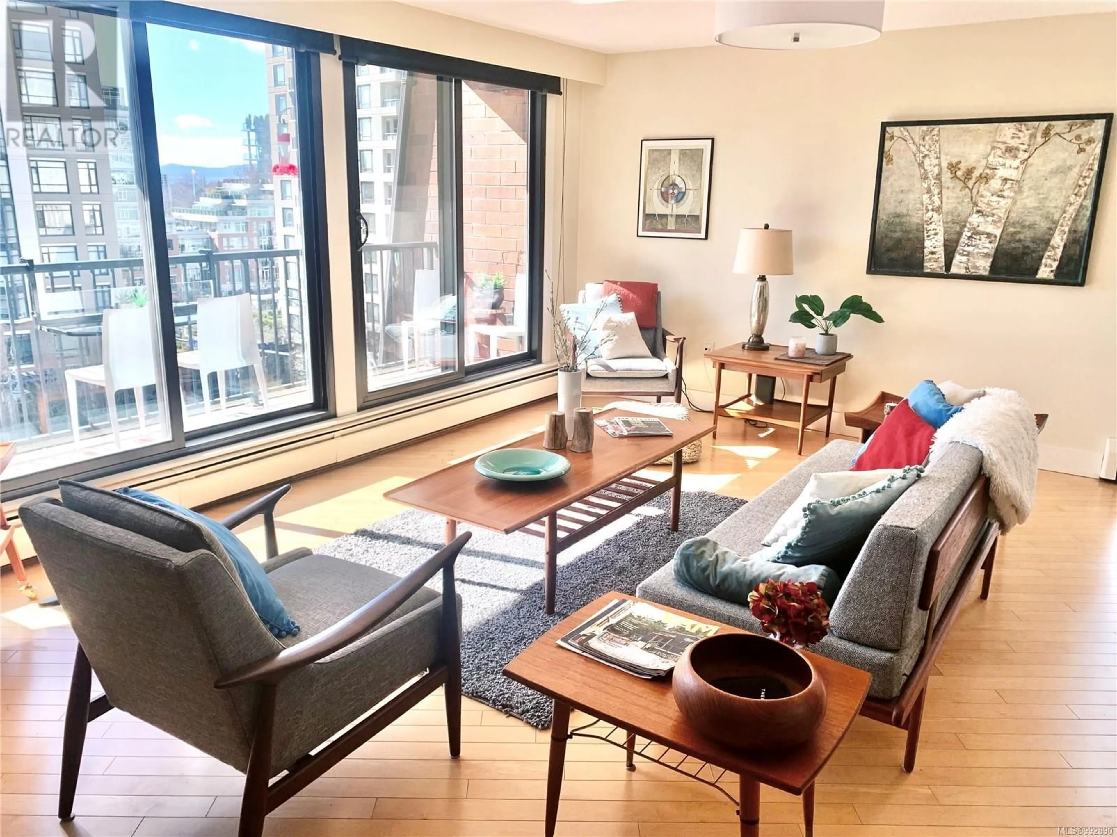 Living room with furniture, wood/laminate floor for 401 777 Blanshard St, Victoria British Columbia V8W2G9