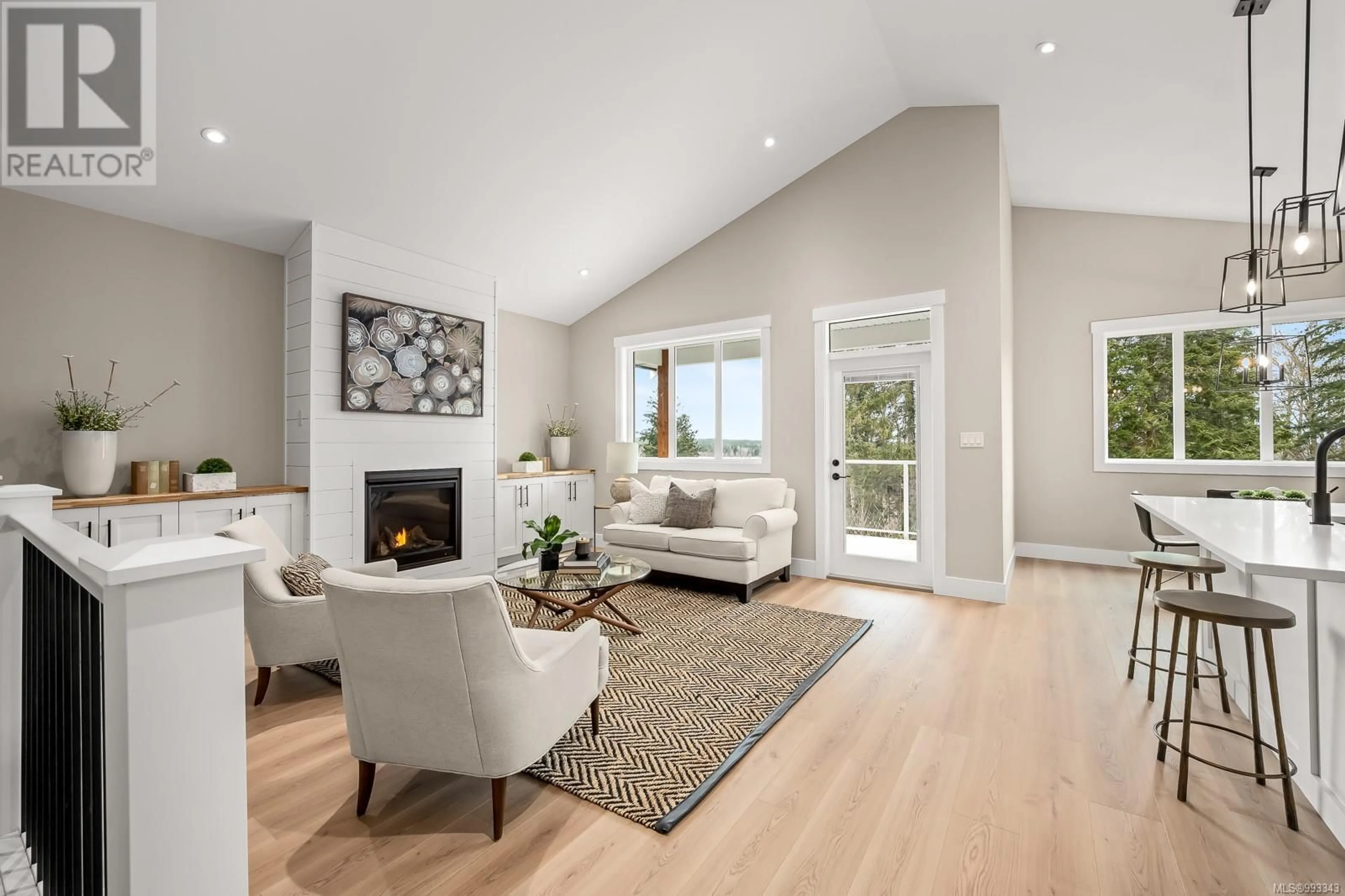 Living room with furniture, wood/laminate floor for 1812 CROWN ISLE BOULEVARD, Courtenay British Columbia V9N0K1