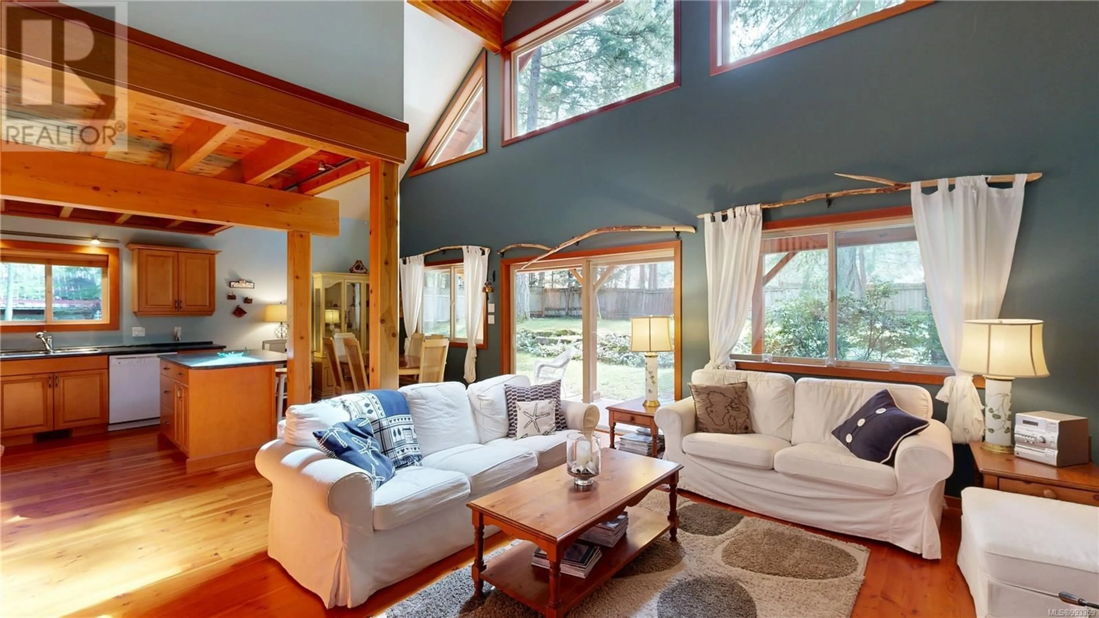 Living room with furniture, wood/laminate floor for 137 MALASPINA DRIVE, Gabriola Island British Columbia V0R1X1