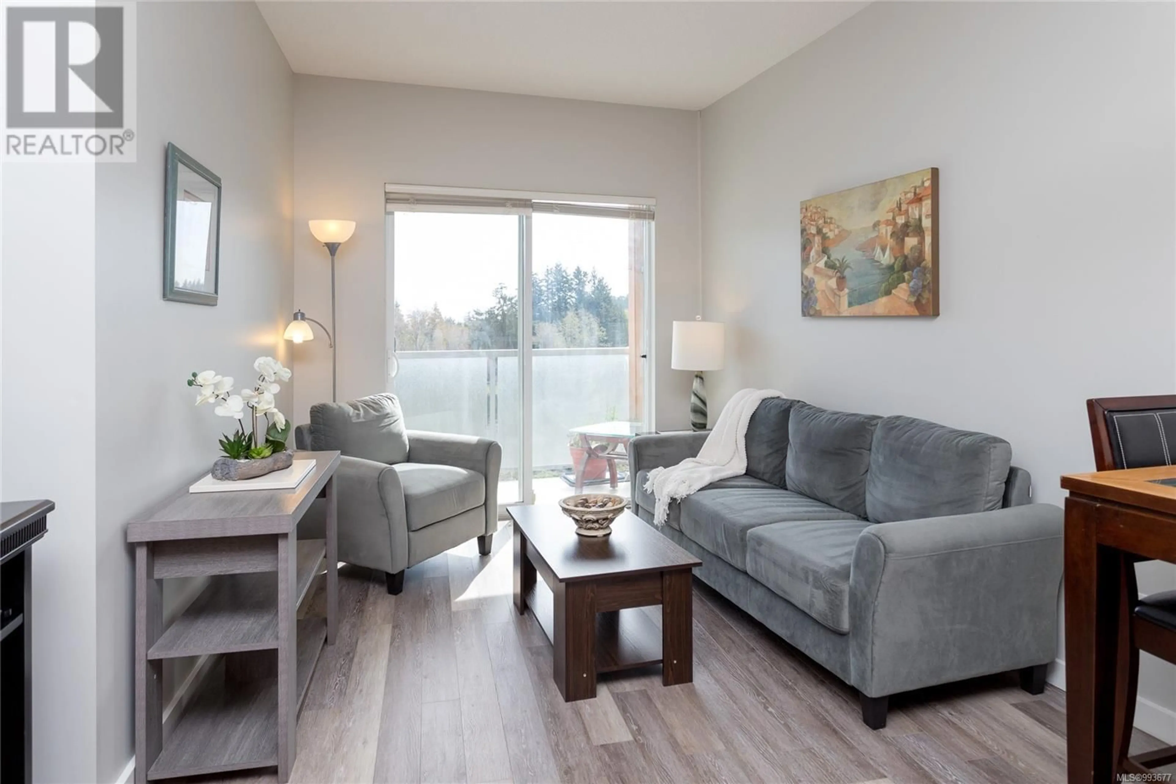 Living room with furniture, wood/laminate floor for 308 - 611 BROOKSIDE ROAD, Colwood British Columbia V9C0C3