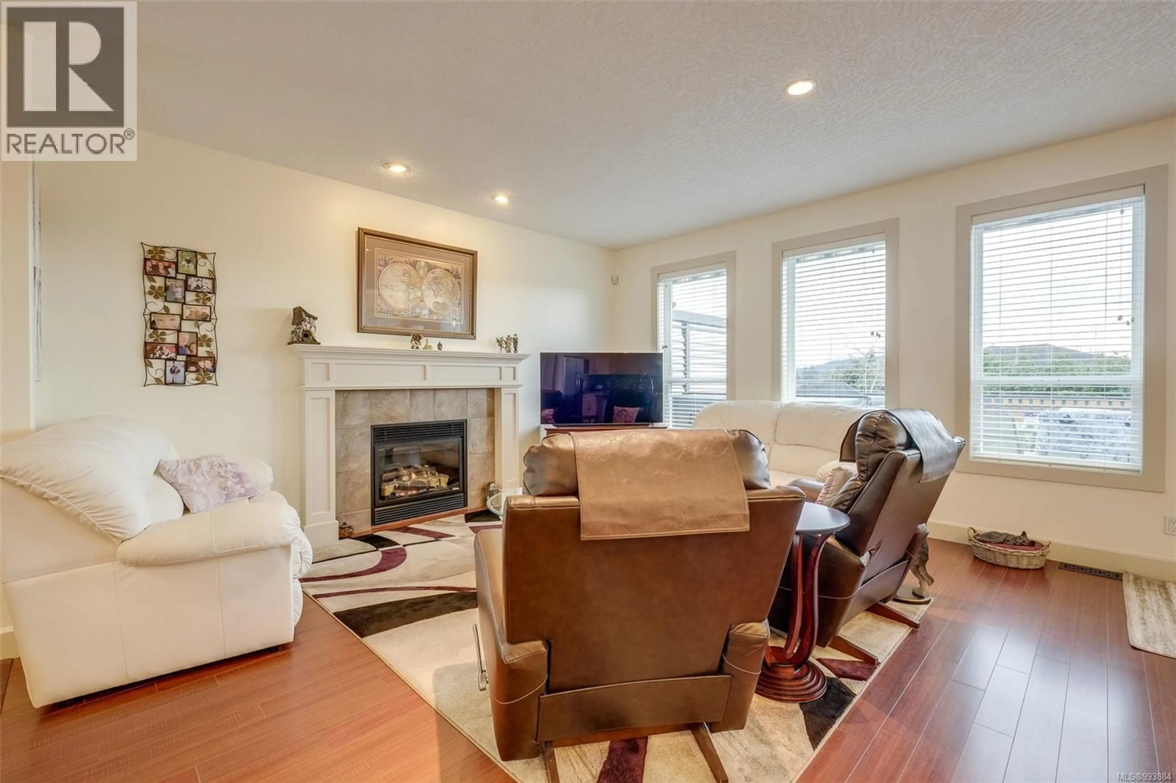 Living room with furniture, wood/laminate floor for 6575 FELDERHOF ROAD, Sooke British Columbia V9Z0V8