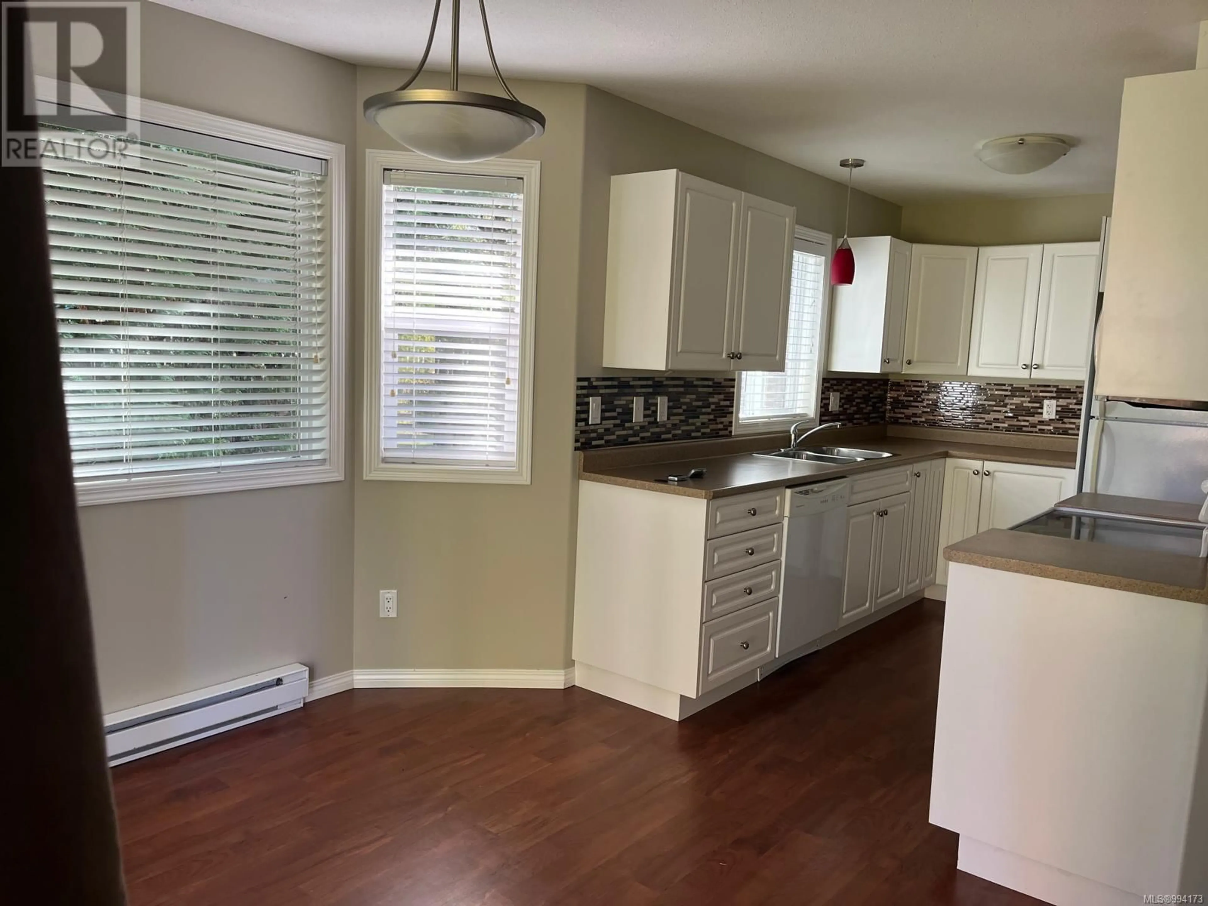Open concept kitchen, wood/laminate floor for 9 - 2882 PIERCY AVENUE, Courtenay British Columbia V9N7E3