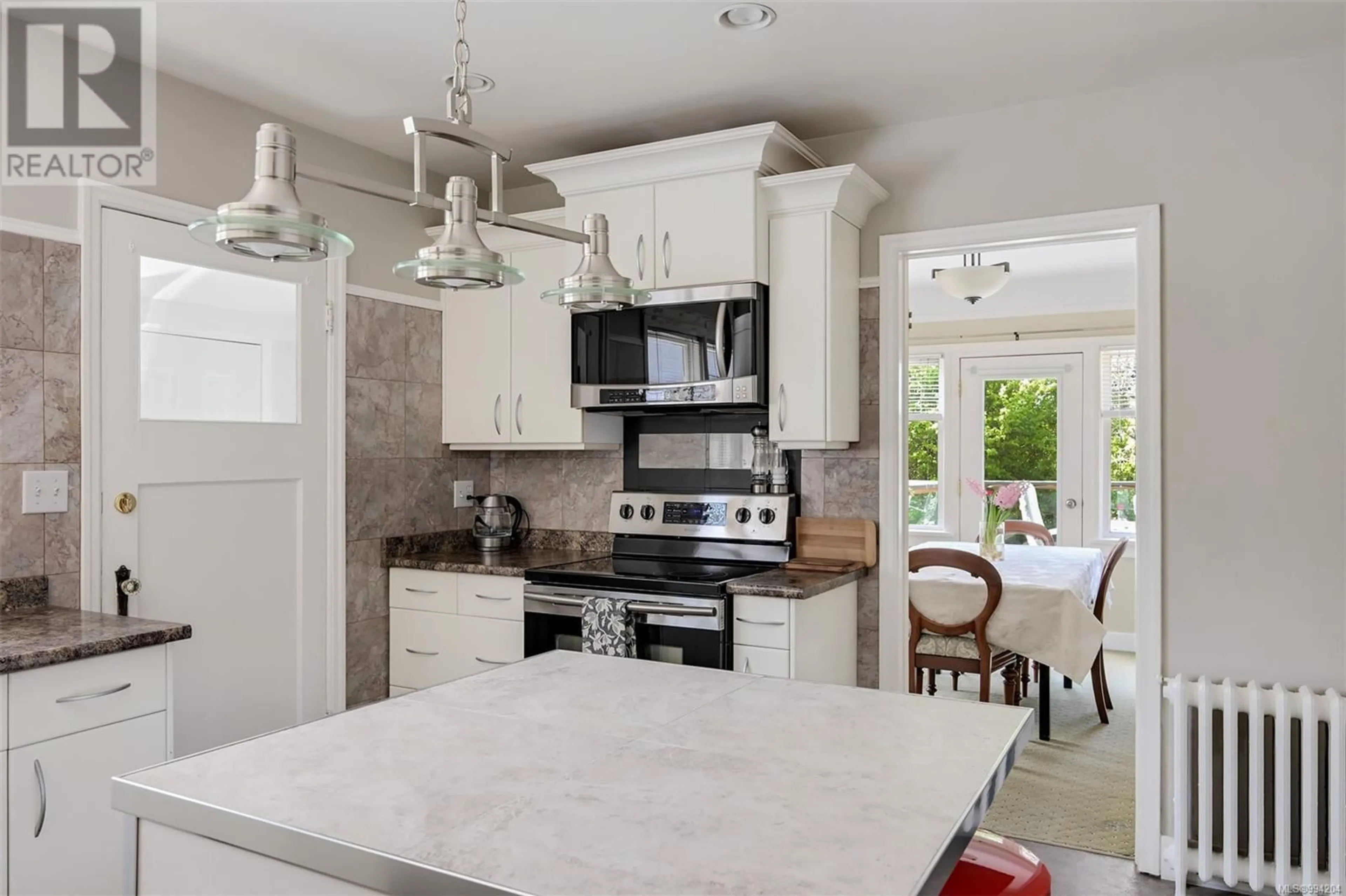 Open concept kitchen, ceramic/tile floor for 1151 REYNOLDS ROAD, Saanich British Columbia V8P2K5