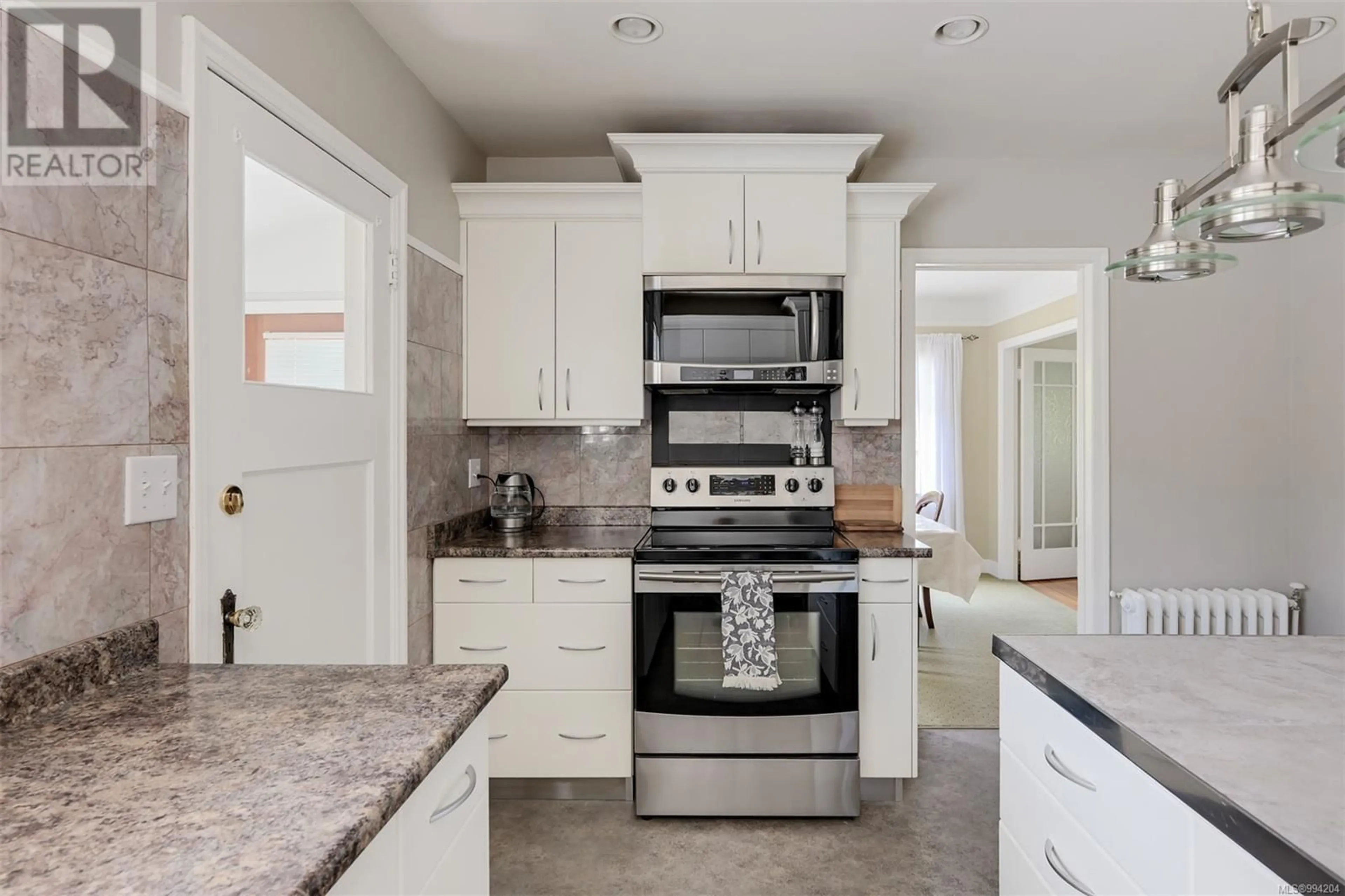 Open concept kitchen, ceramic/tile floor for 1151 REYNOLDS ROAD, Saanich British Columbia V8P2K5