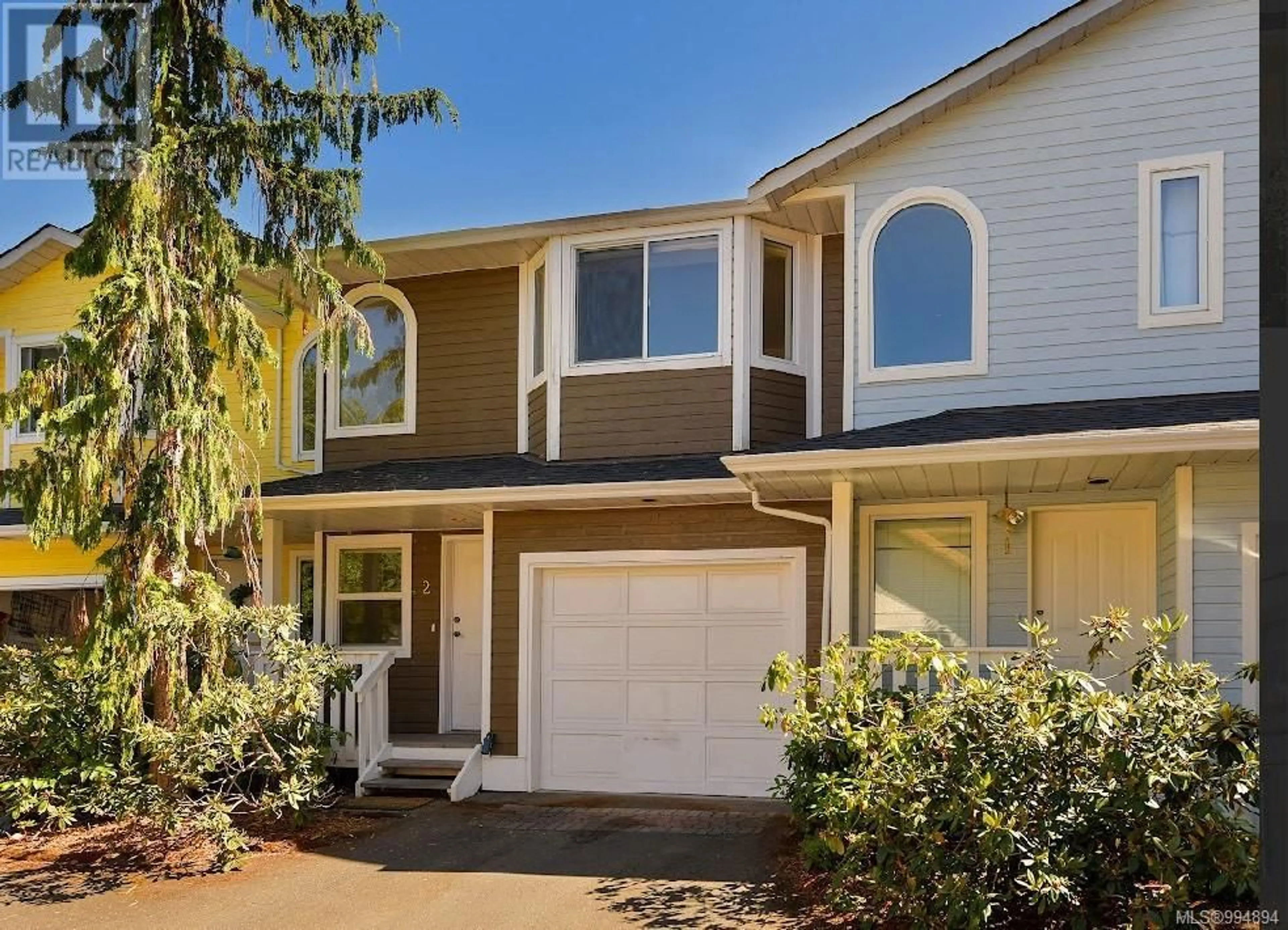 Home with vinyl exterior material, street for 2 - 10549 MCDONALD PARK ROAD, Sidney British Columbia V8L3J2
