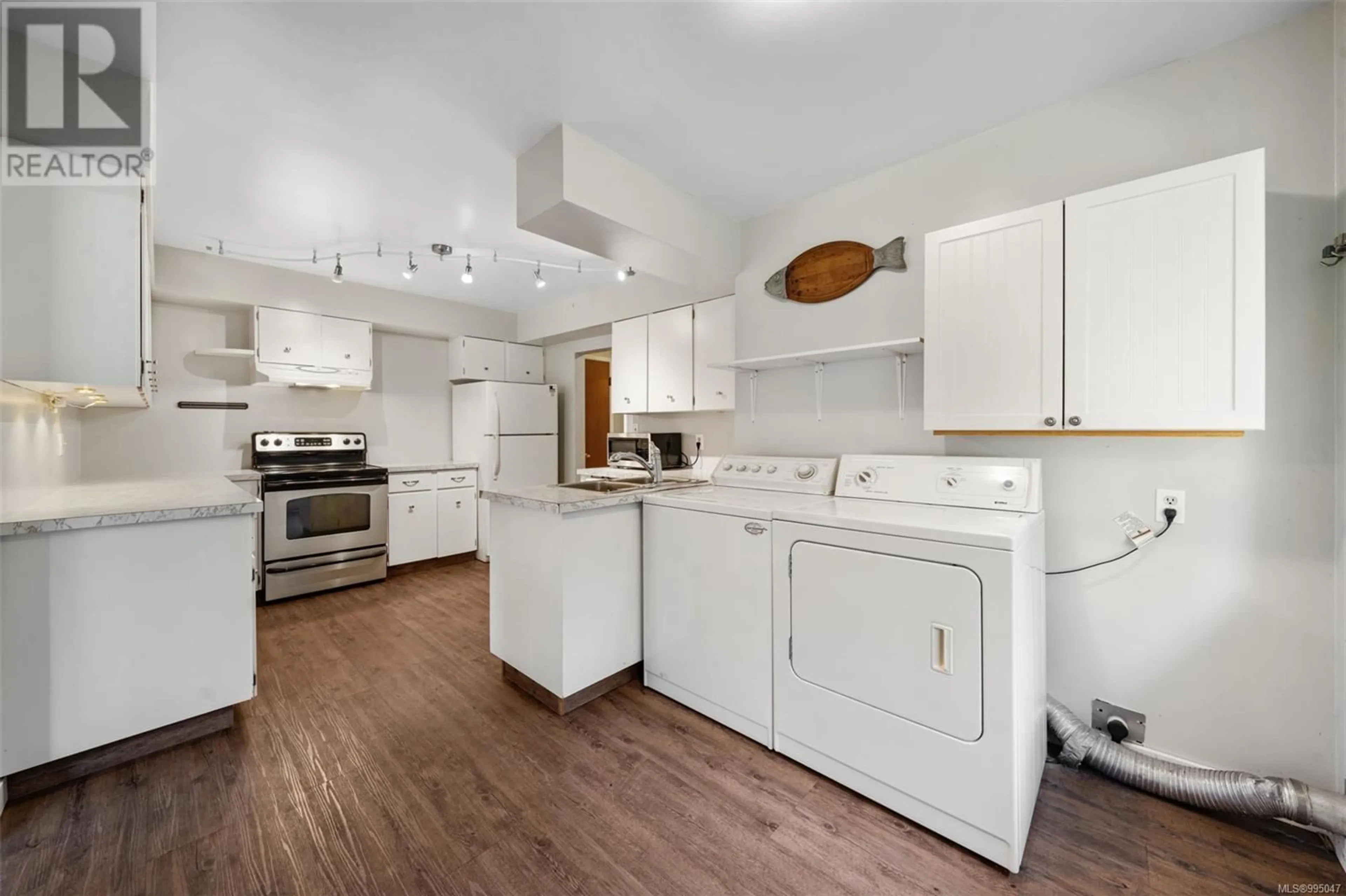 Kitchen with laundary machines, unknown for 2437 SOOKE ROAD, Colwood British Columbia V9B1Y1