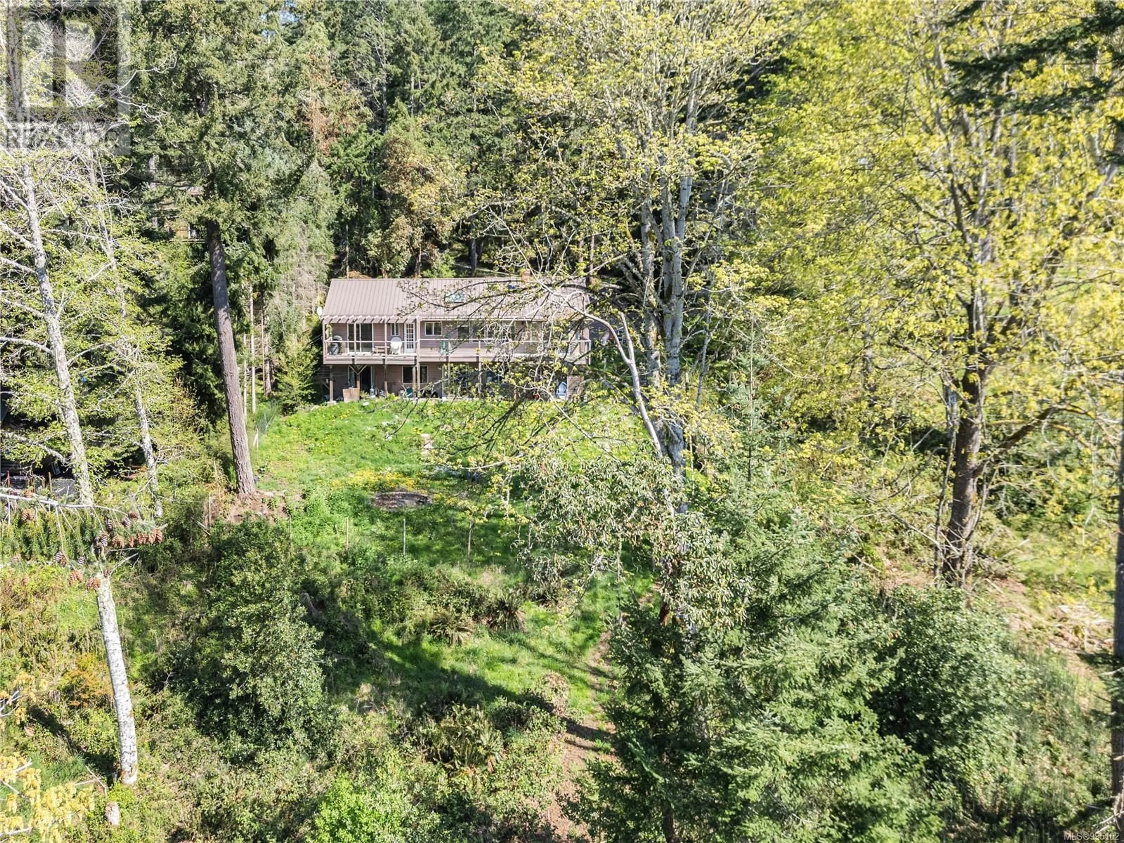 A pic from outside/outdoor area/front of a property/back of a property/a pic from drone, forest/trees view for 130 LAUTMAN DRIVE, Salt Spring British Columbia V8K2C2