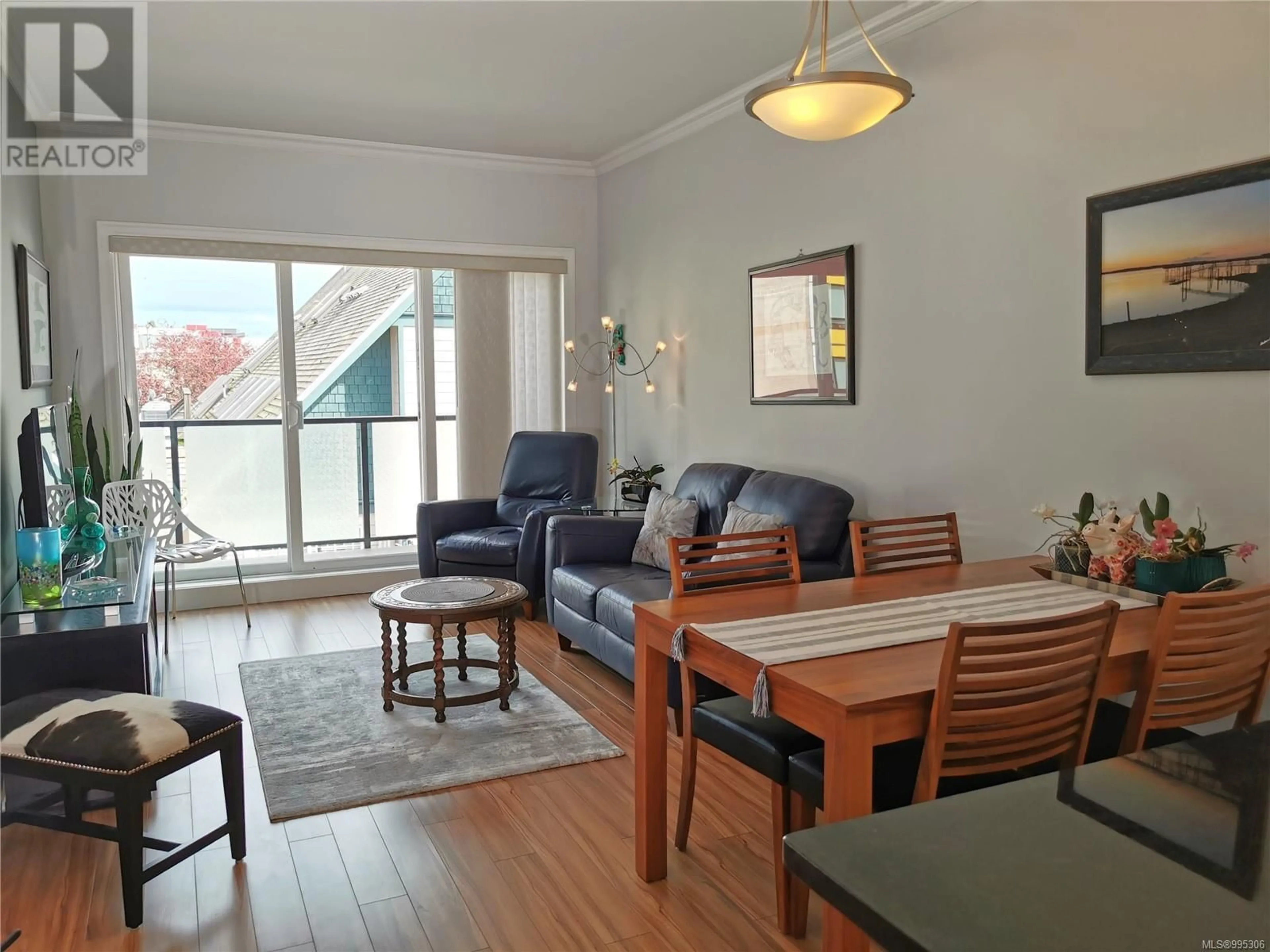Living room with furniture, wood/laminate floor for 307 - 9751 FOURTH STREET, Sidney British Columbia V8L2Y9