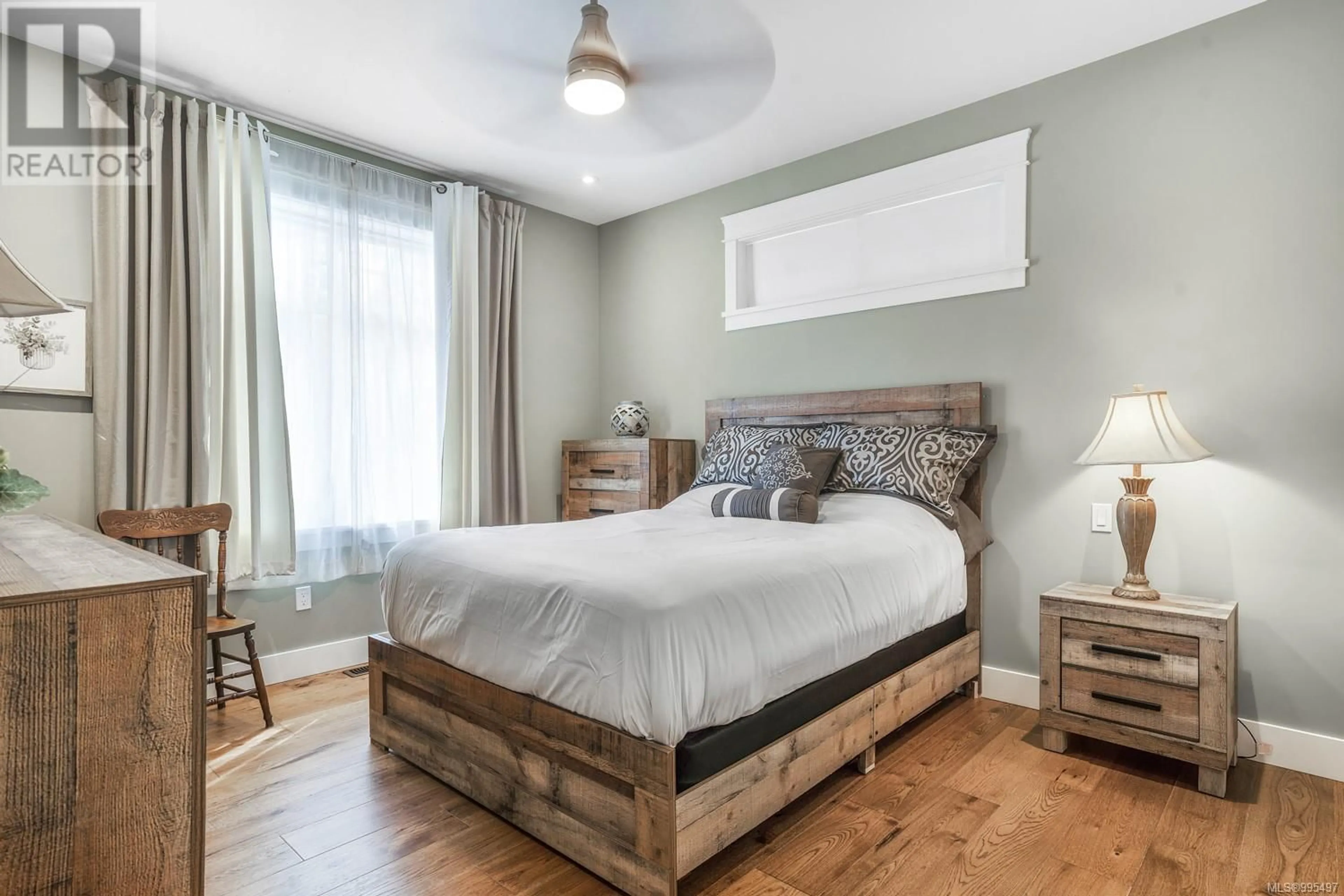 Bedroom with bed, wood/laminate floor for 2769 ANDYS LANE, Nanoose Bay British Columbia V9P9J4