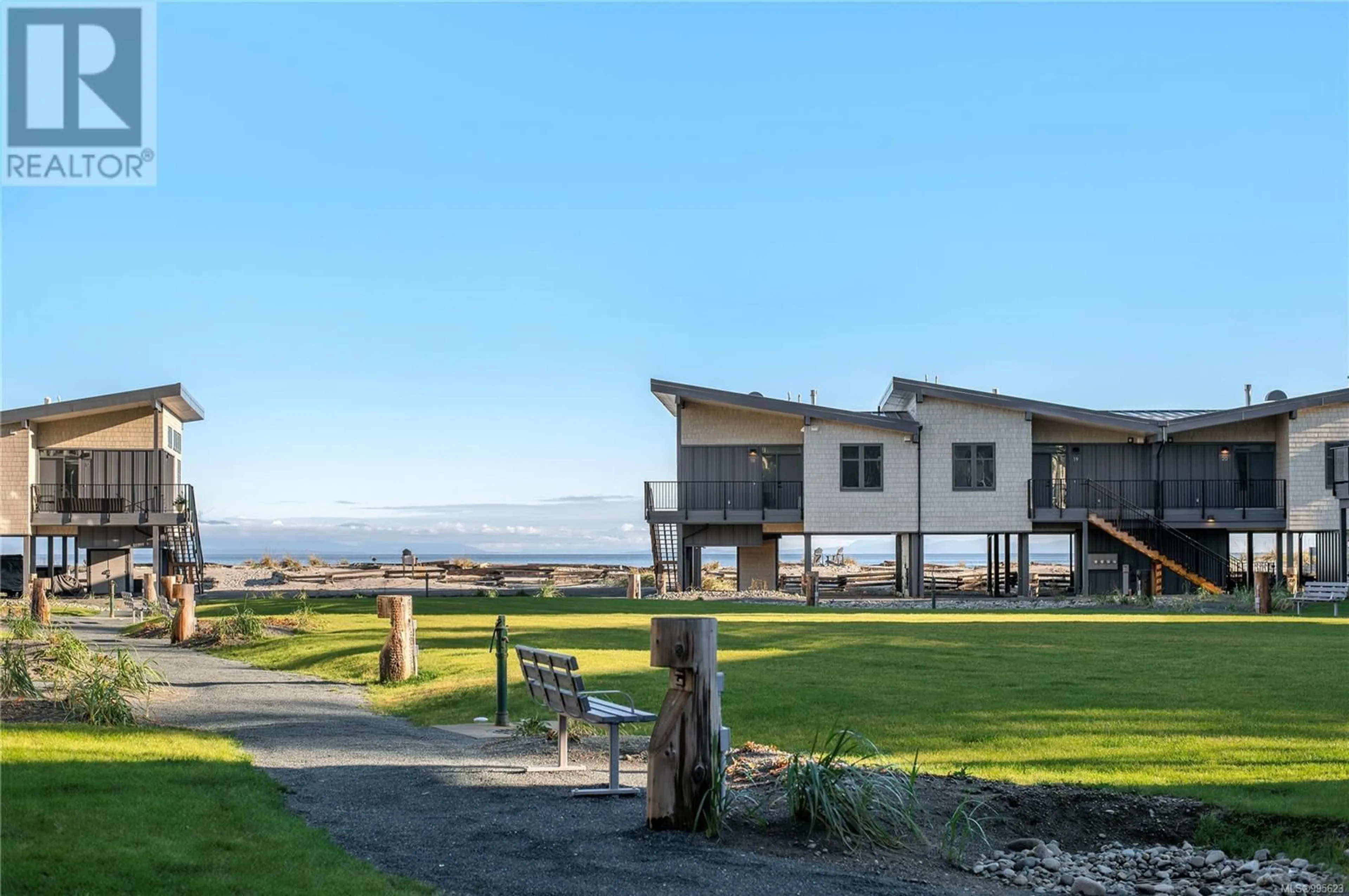 A pic from outside/outdoor area/front of a property/back of a property/a pic from drone, mountain view for 4 - 9022 CLARKSON AVENUE, Black Creek British Columbia V9J1B2