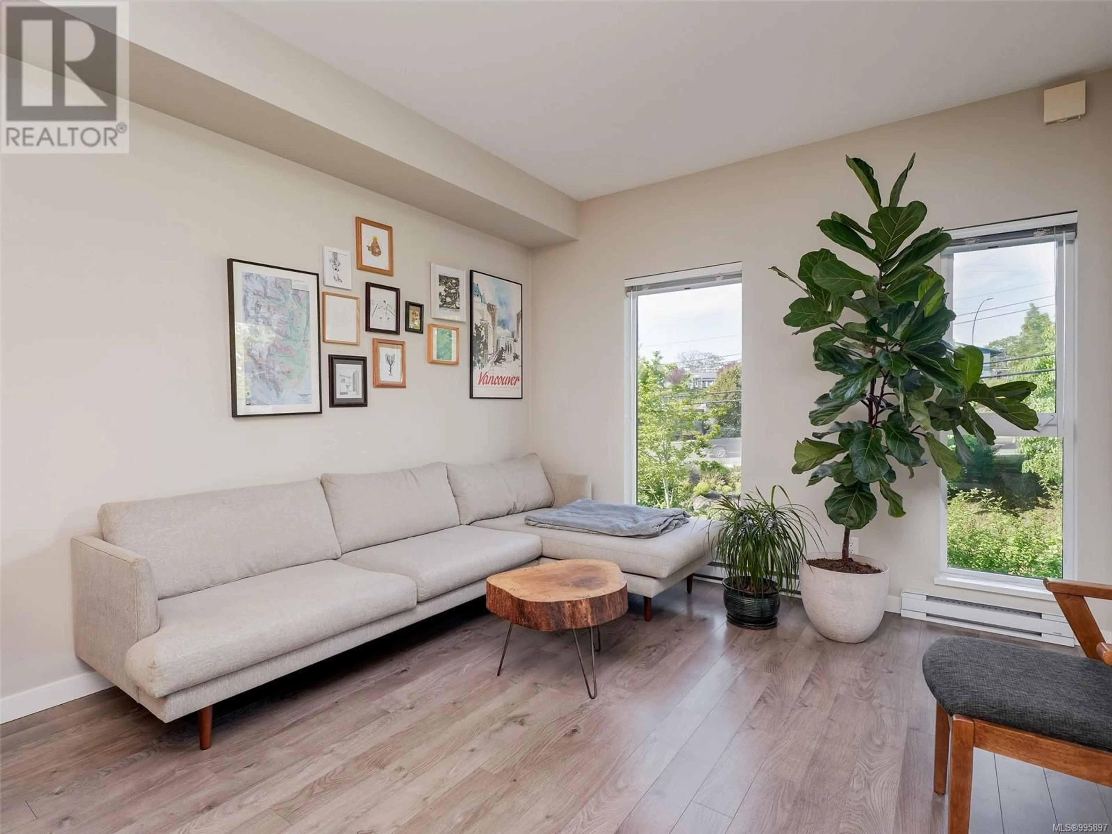 Living room with furniture, wood/laminate floor for 420 - 767 TYEE ROAD, Victoria British Columbia V9A0G5