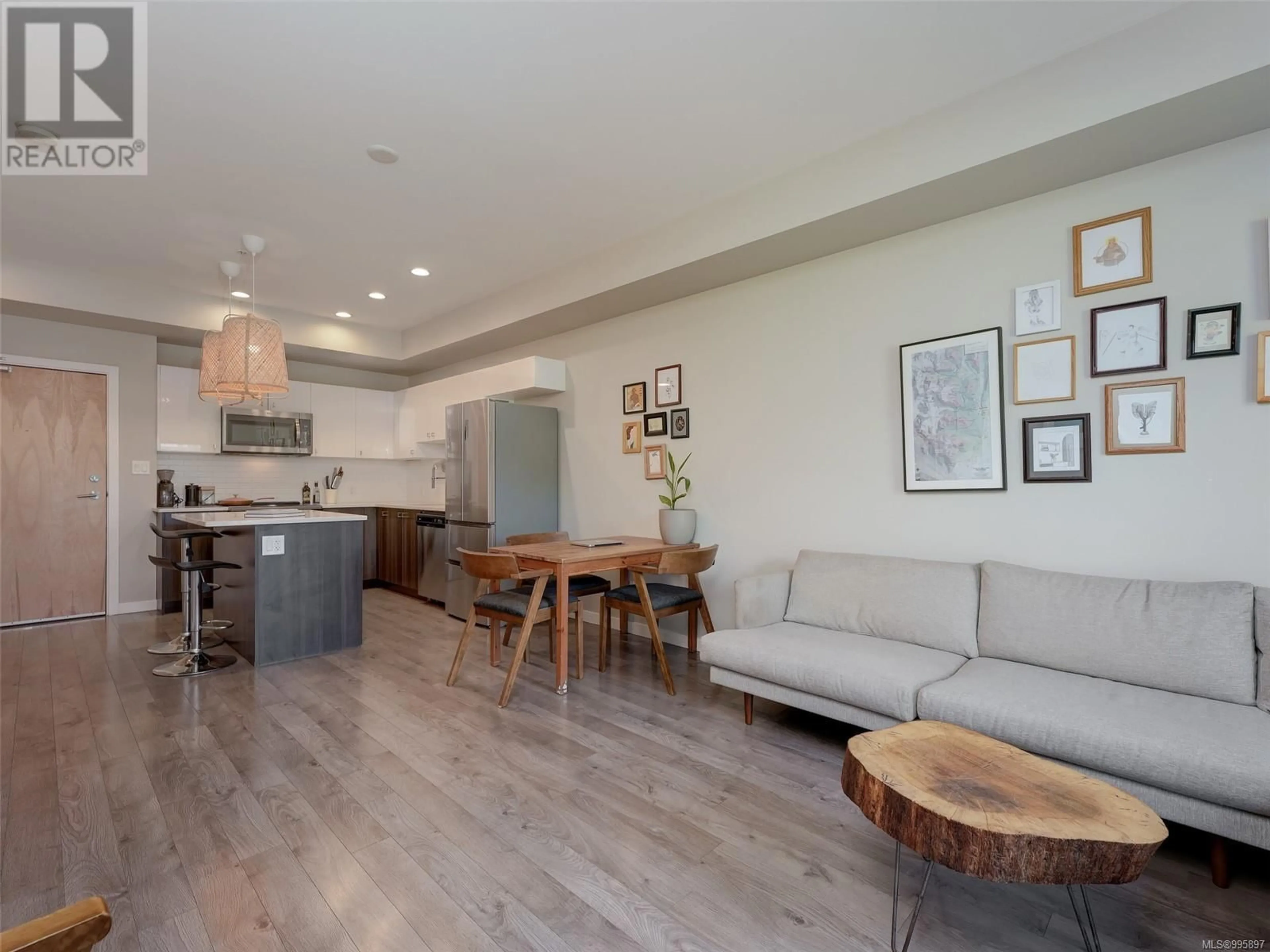 Living room with furniture, wood/laminate floor for 420 - 767 TYEE ROAD, Victoria British Columbia V9A0G5