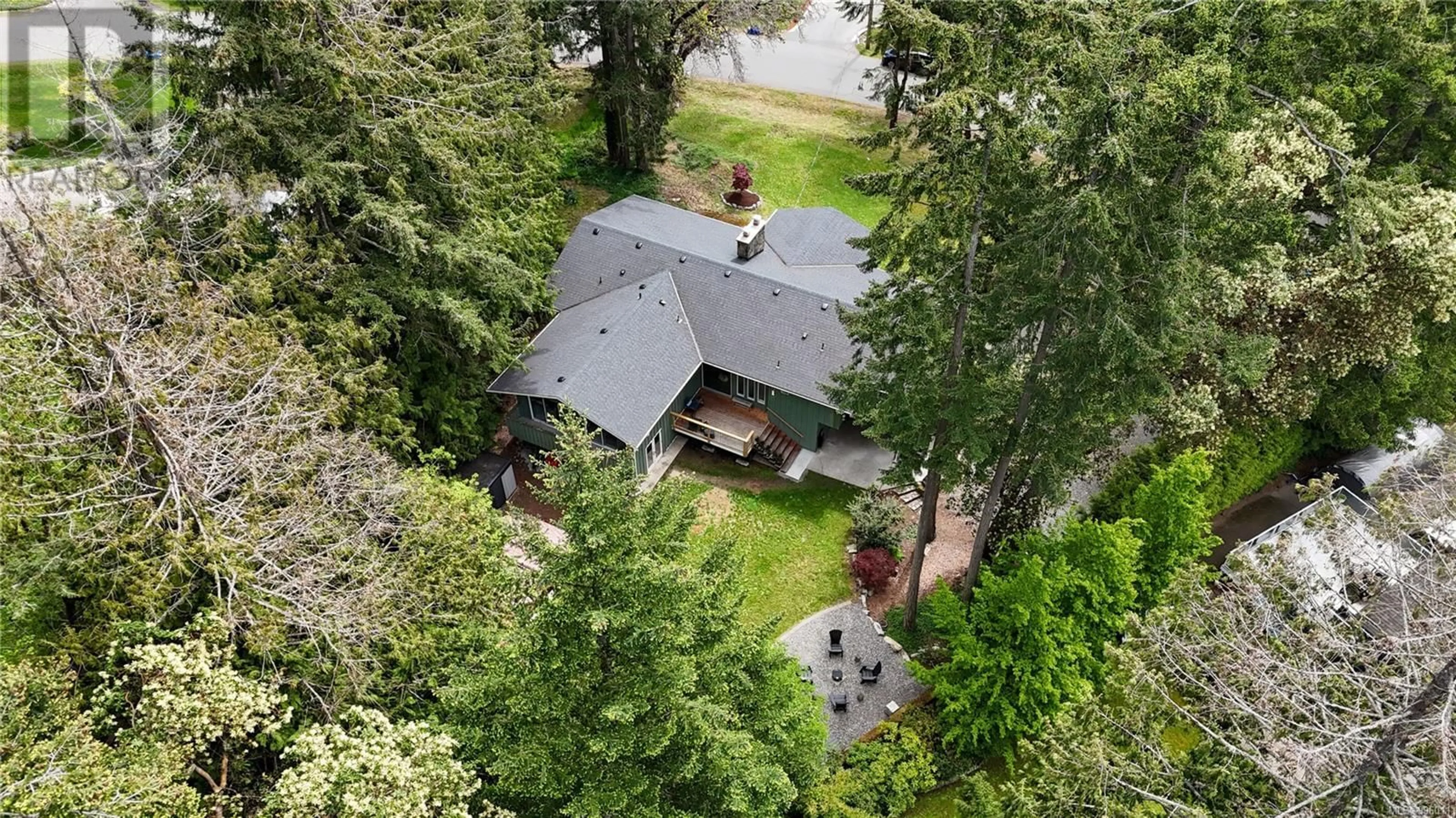 A pic from outside/outdoor area/front of a property/back of a property/a pic from drone, forest/trees view for 1940 SANDOVER CRESCENT, North Saanich British Columbia V8L1A1