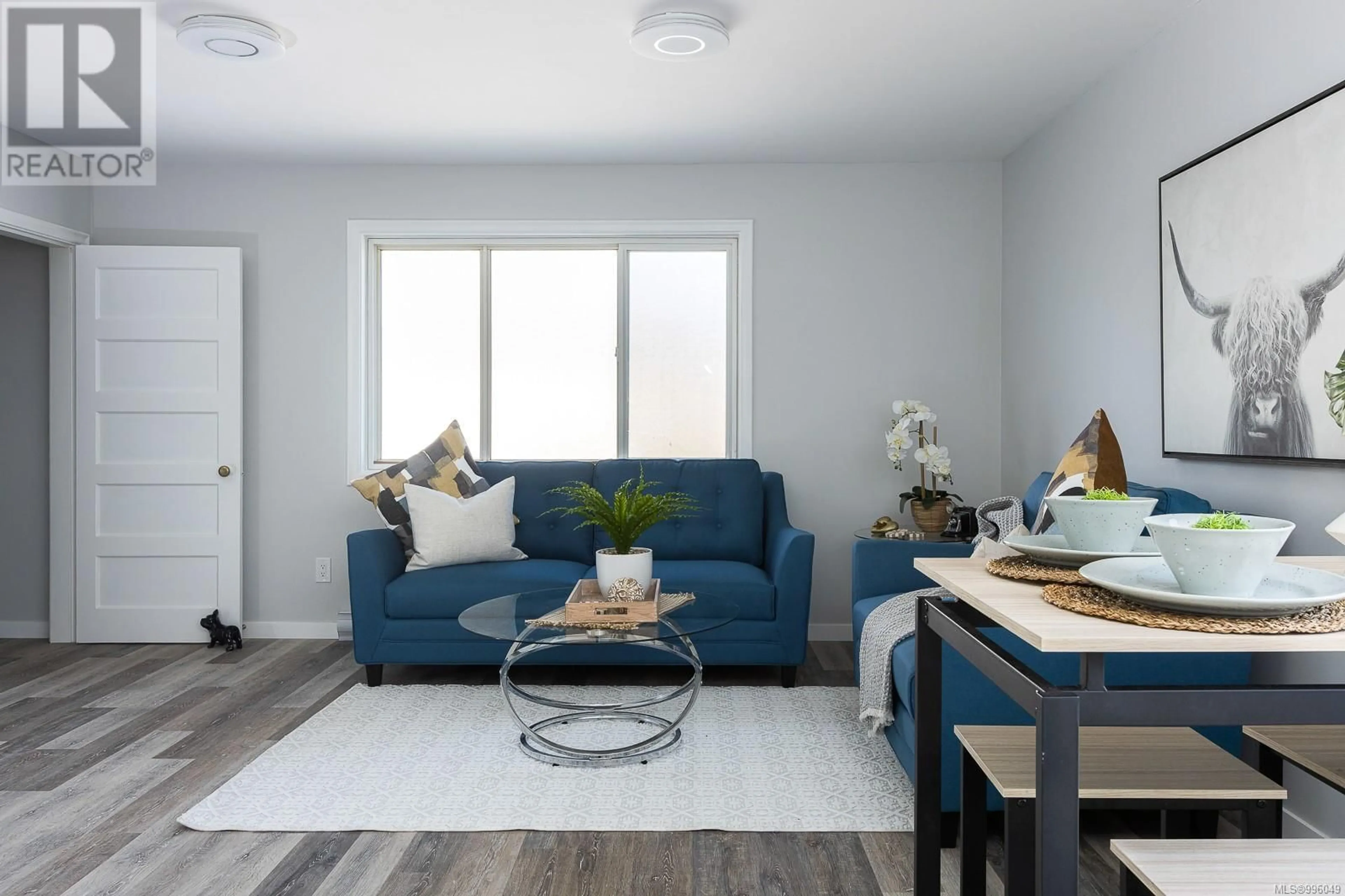 Living room with furniture, wood/laminate floor for A - 83 SIMS AVENUE, Saanich British Columbia V8Z1J9
