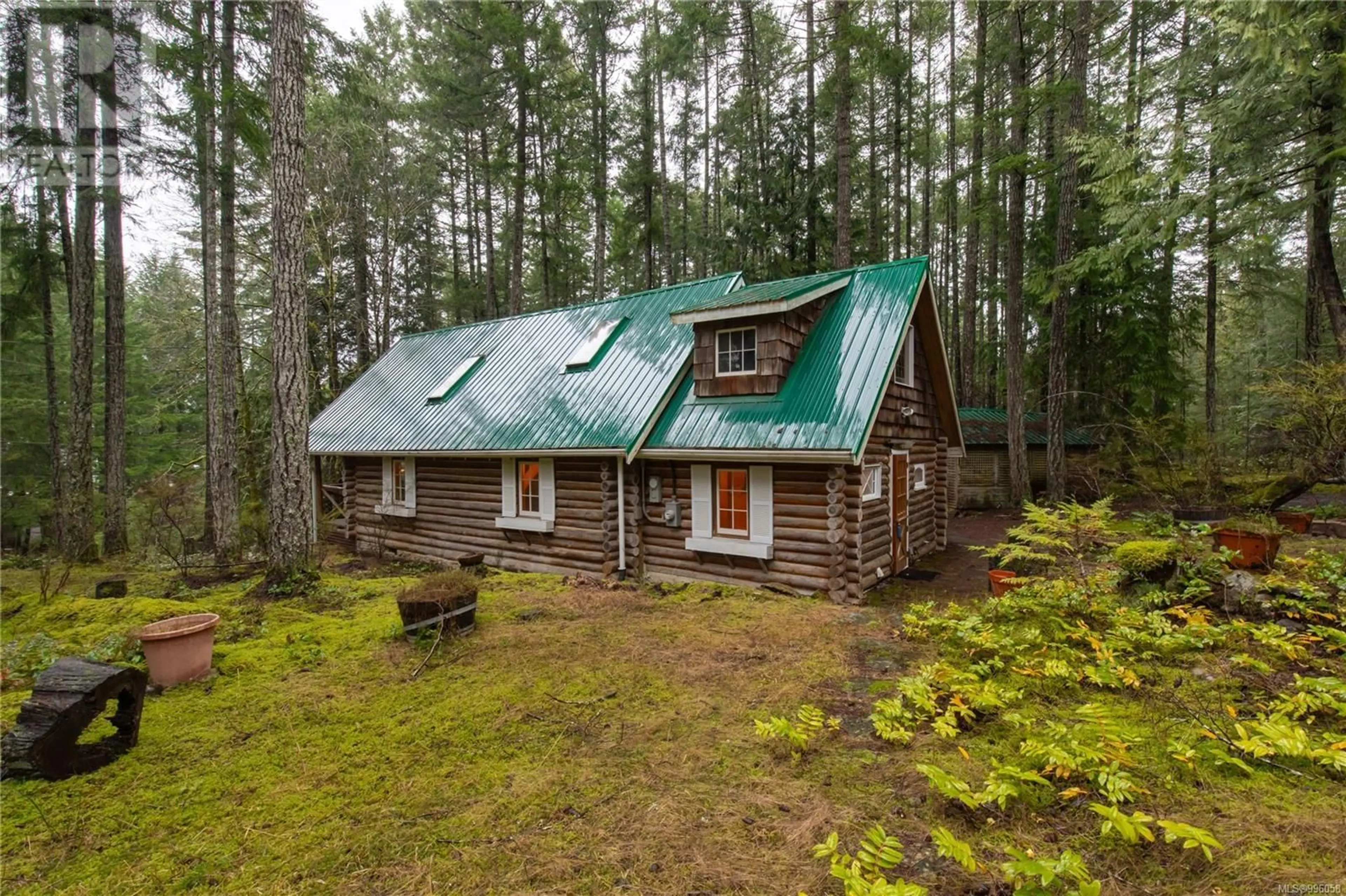 A pic from outside/outdoor area/front of a property/back of a property/a pic from drone, forest/trees view for 5100 NORTHWEST ROAD, Denman Island British Columbia V0R1T0