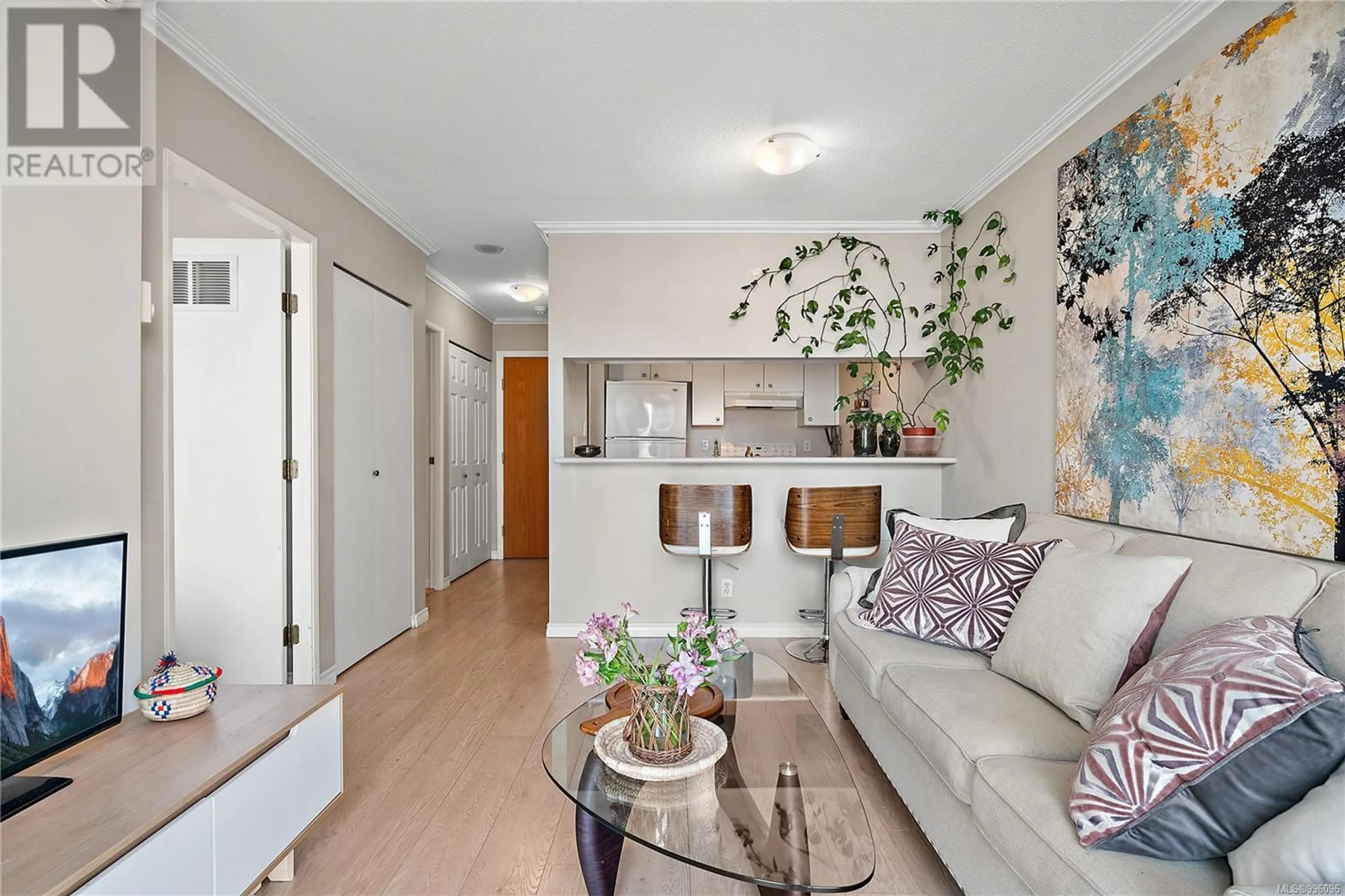 Living room with furniture, wood/laminate floor for 609 - 835 VIEW STREET, Victoria British Columbia V8W3W8