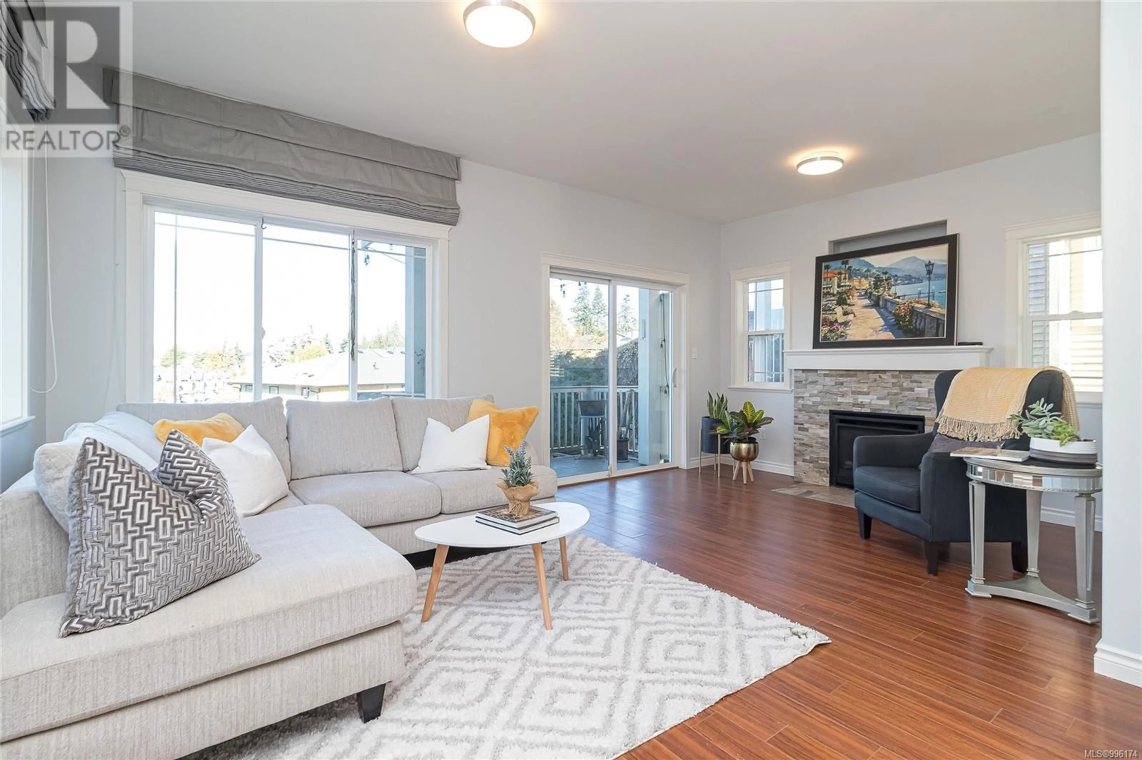 Living room with furniture, wood/laminate floor for 952 WALFRED ROAD, Langford British Columbia V9C2P4