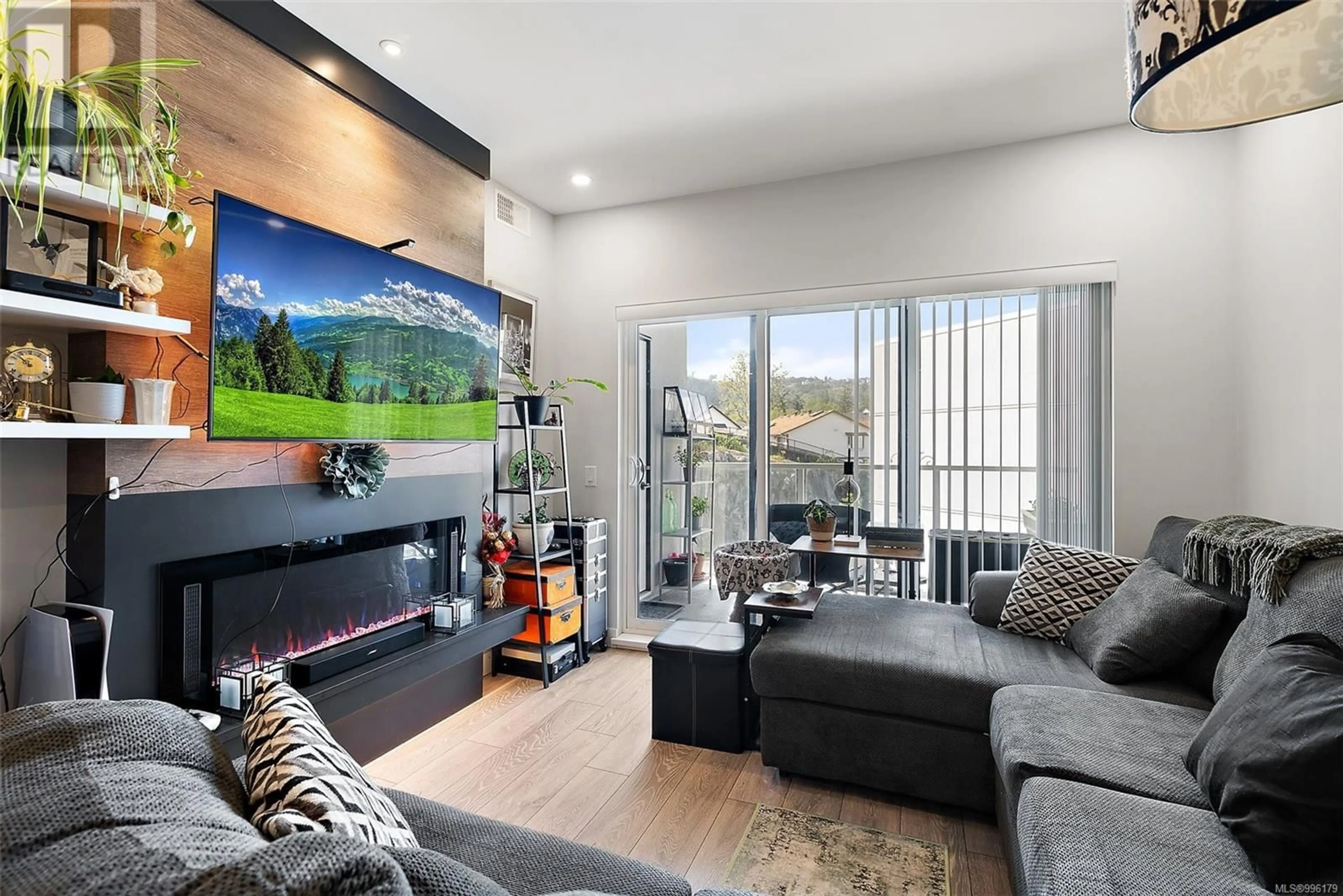 Living room with furniture, wood/laminate floor for 303 - 950 WHIRLAWAY CRESCENT, Langford British Columbia V9B0Y3