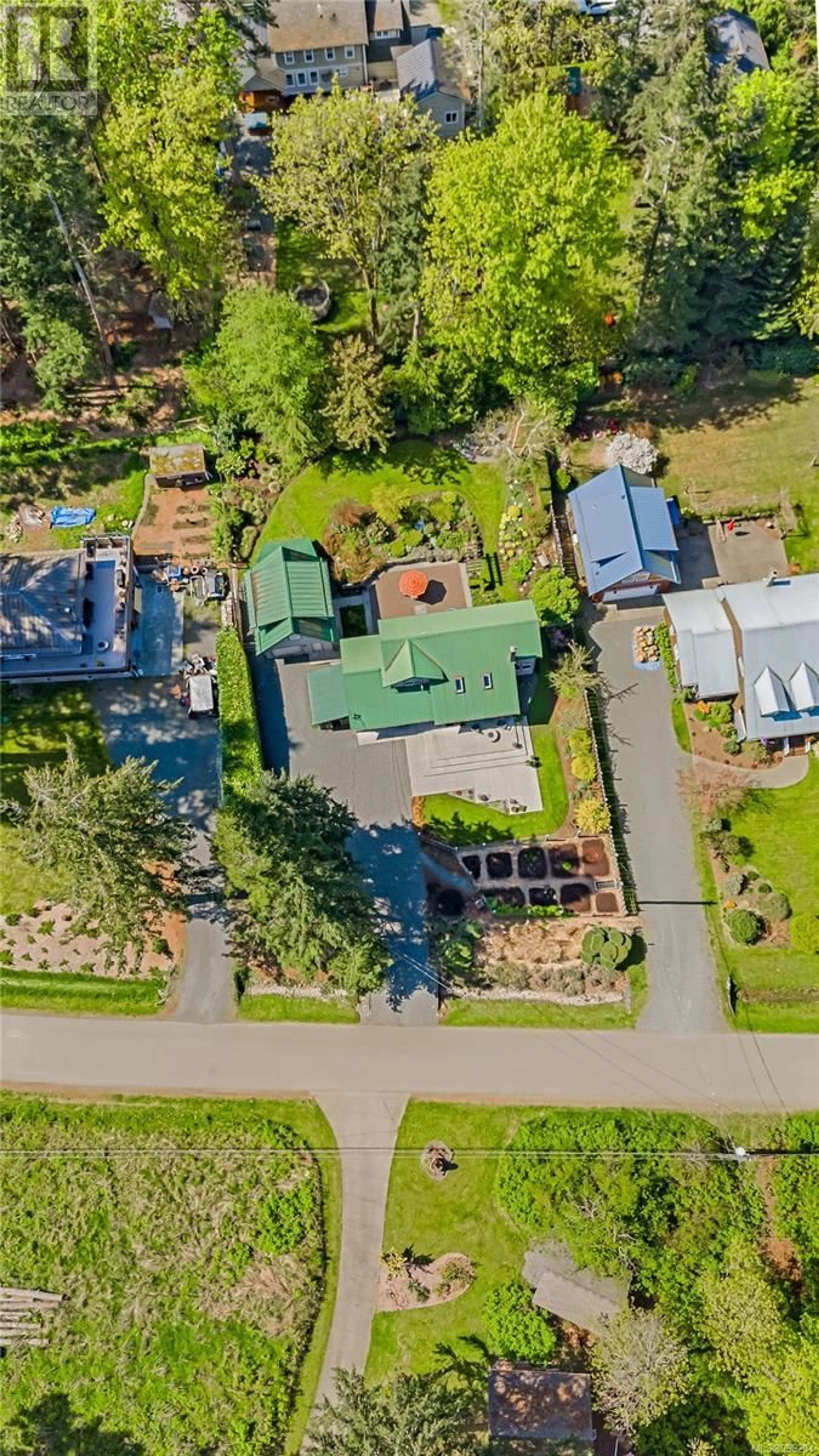 A pic from outside/outdoor area/front of a property/back of a property/a pic from drone, street for 5899 ALDERGROVE DRIVE, Courtenay British Columbia V9N1W2
