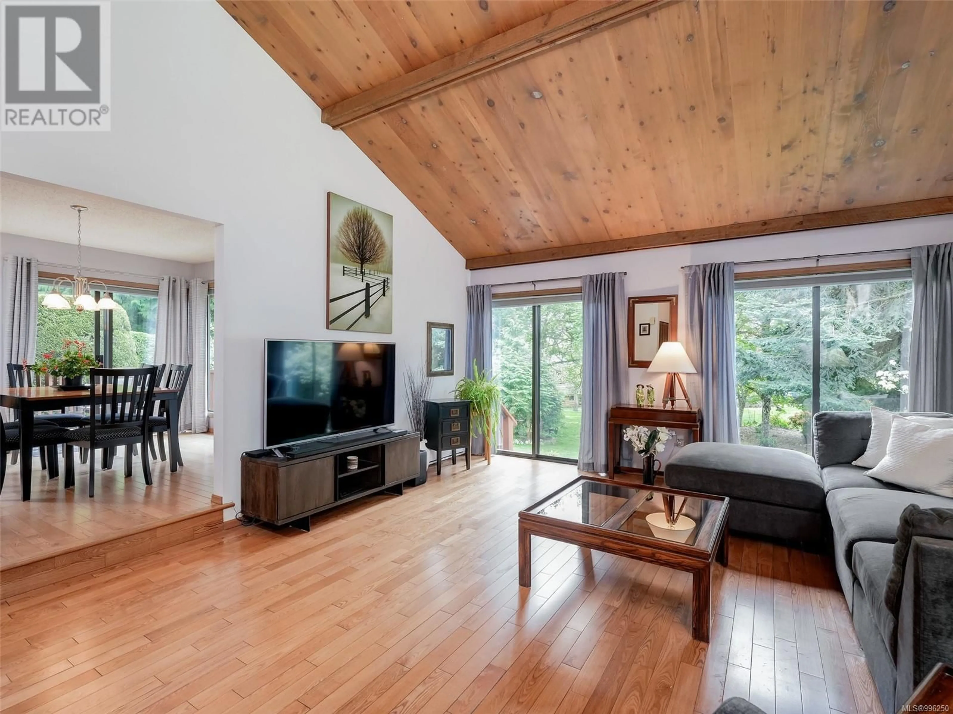 Living room with furniture, wood/laminate floor for 1647 STUART PARK TERRACE, North Saanich British Columbia V8L4R6