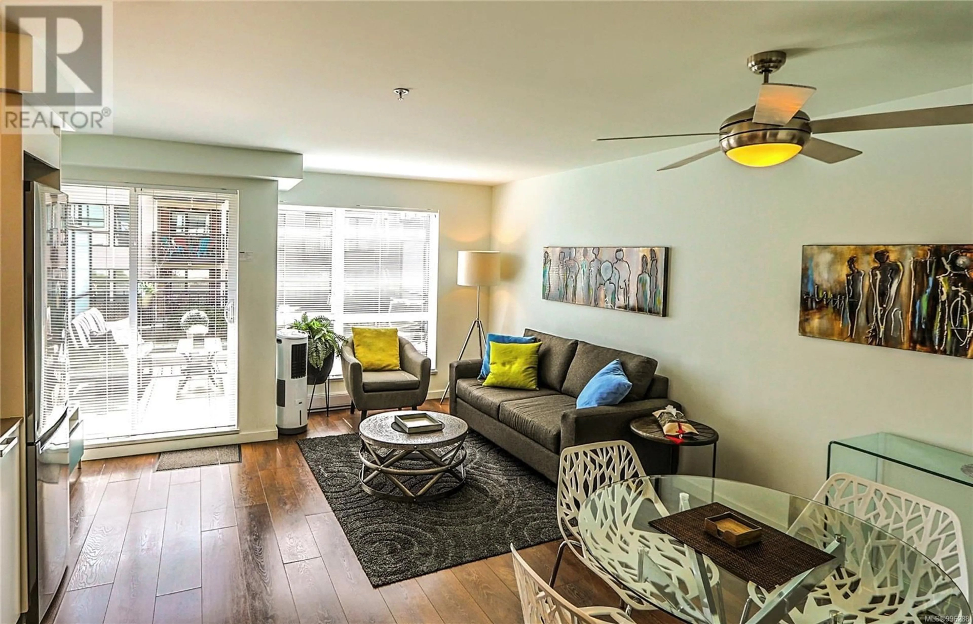 Living room with furniture, wood/laminate floor for 212 - 517 FISGARD STREET, Victoria British Columbia V8W0C5
