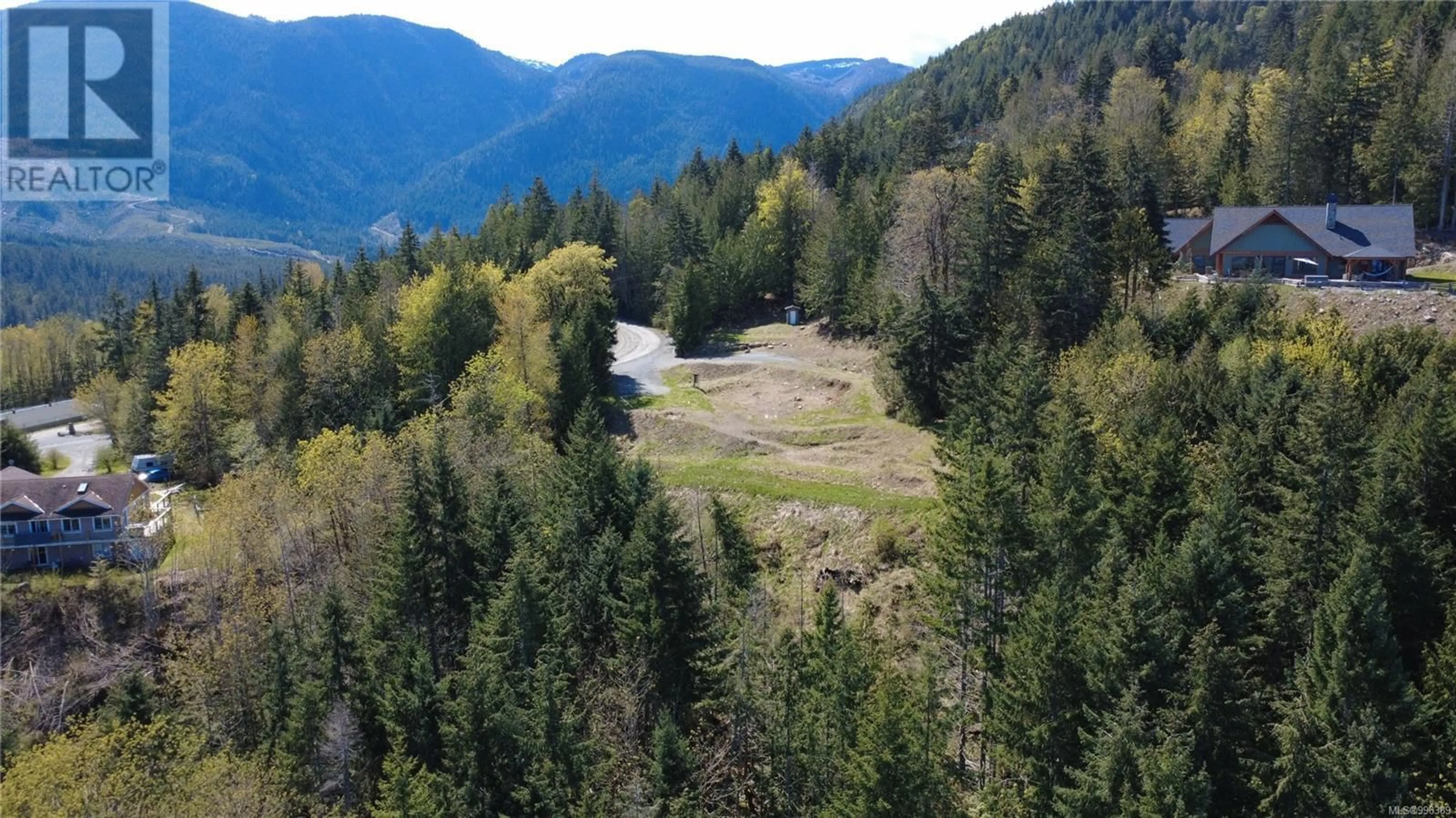 A pic from outside/outdoor area/front of a property/back of a property/a pic from drone, forest/trees view for 1725 WARN WAY, Qualicum Beach British Columbia V9K2S3