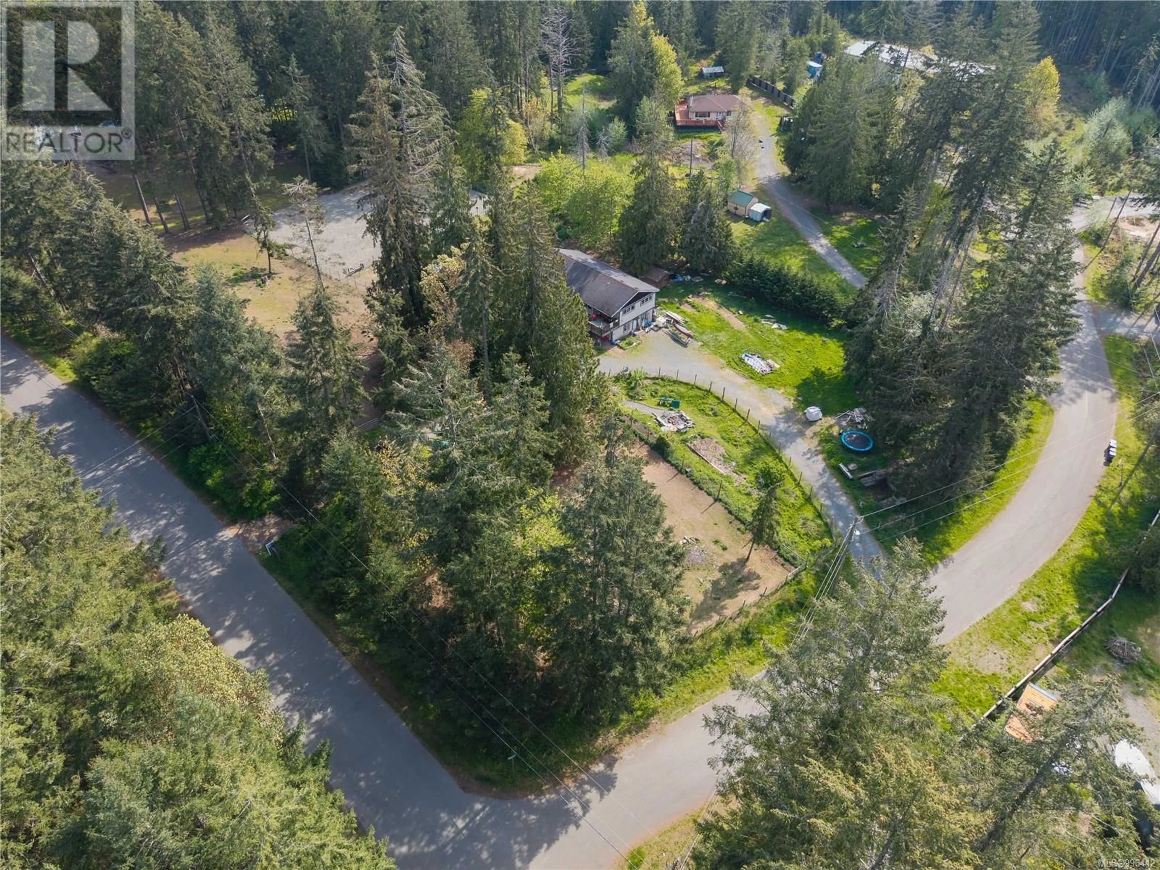 A pic from outside/outdoor area/front of a property/back of a property/a pic from drone, forest/trees view for 3455 MCGUIRE WAY, Nanaimo British Columbia V9G1C4