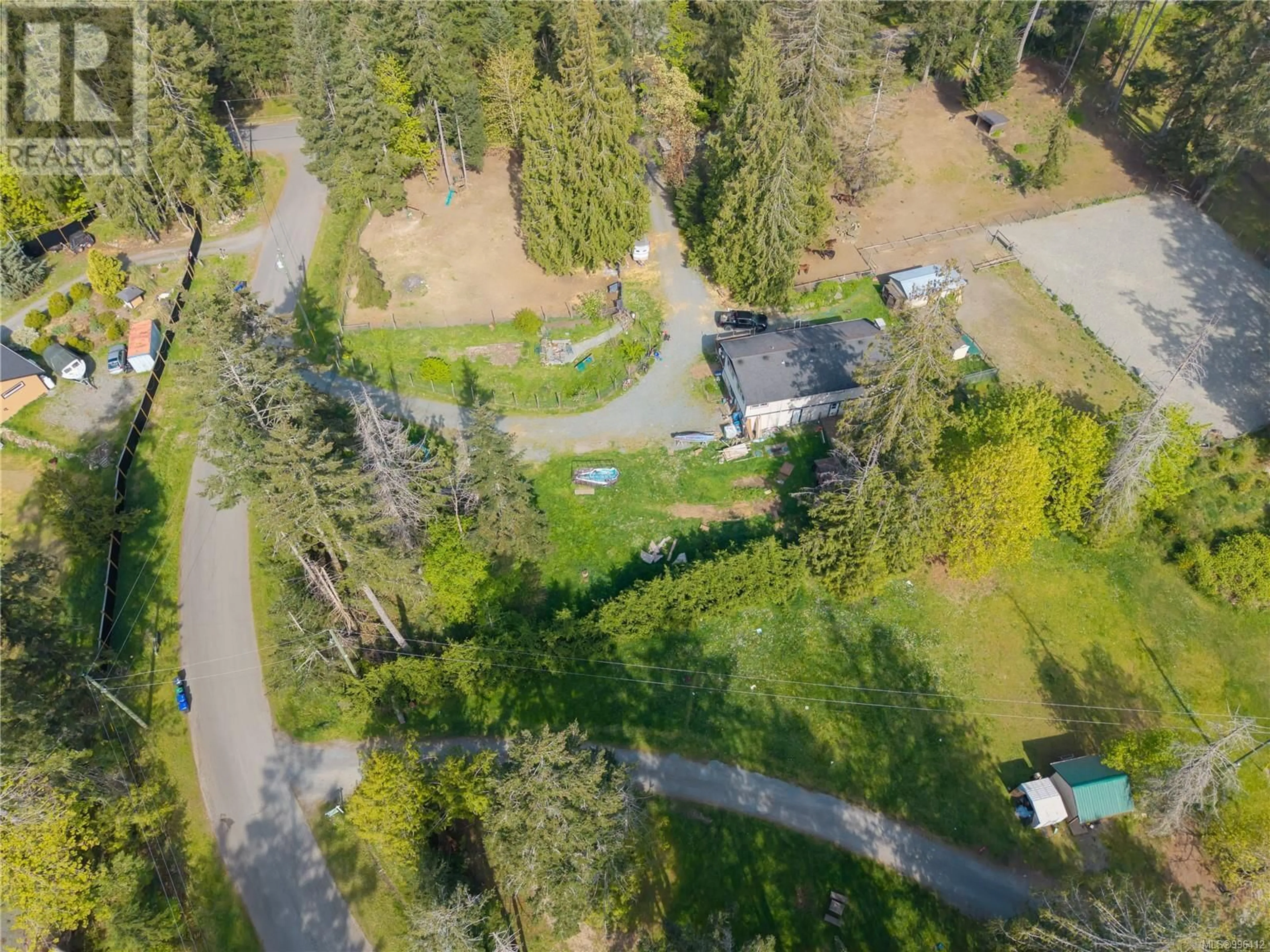 A pic from outside/outdoor area/front of a property/back of a property/a pic from drone, forest/trees view for 3455 MCGUIRE WAY, Nanaimo British Columbia V9G1C4